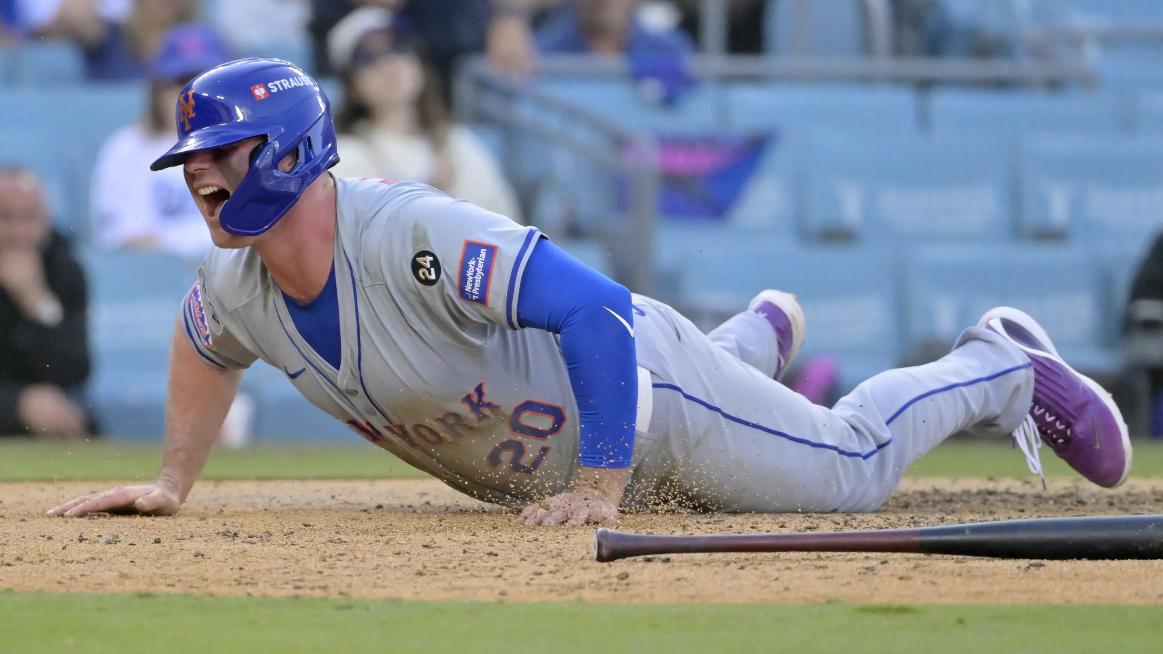 Oct 14, 2024; Los Angeles, California, USA; New York Mets first baseman Pete Alonso (20) celebrates after scoring in the ninth inning during game two of the NLCS for the 2024 MLB Playoffs at Dodger Stadium. / Jayne Kamin-Oncea - Imagn Images