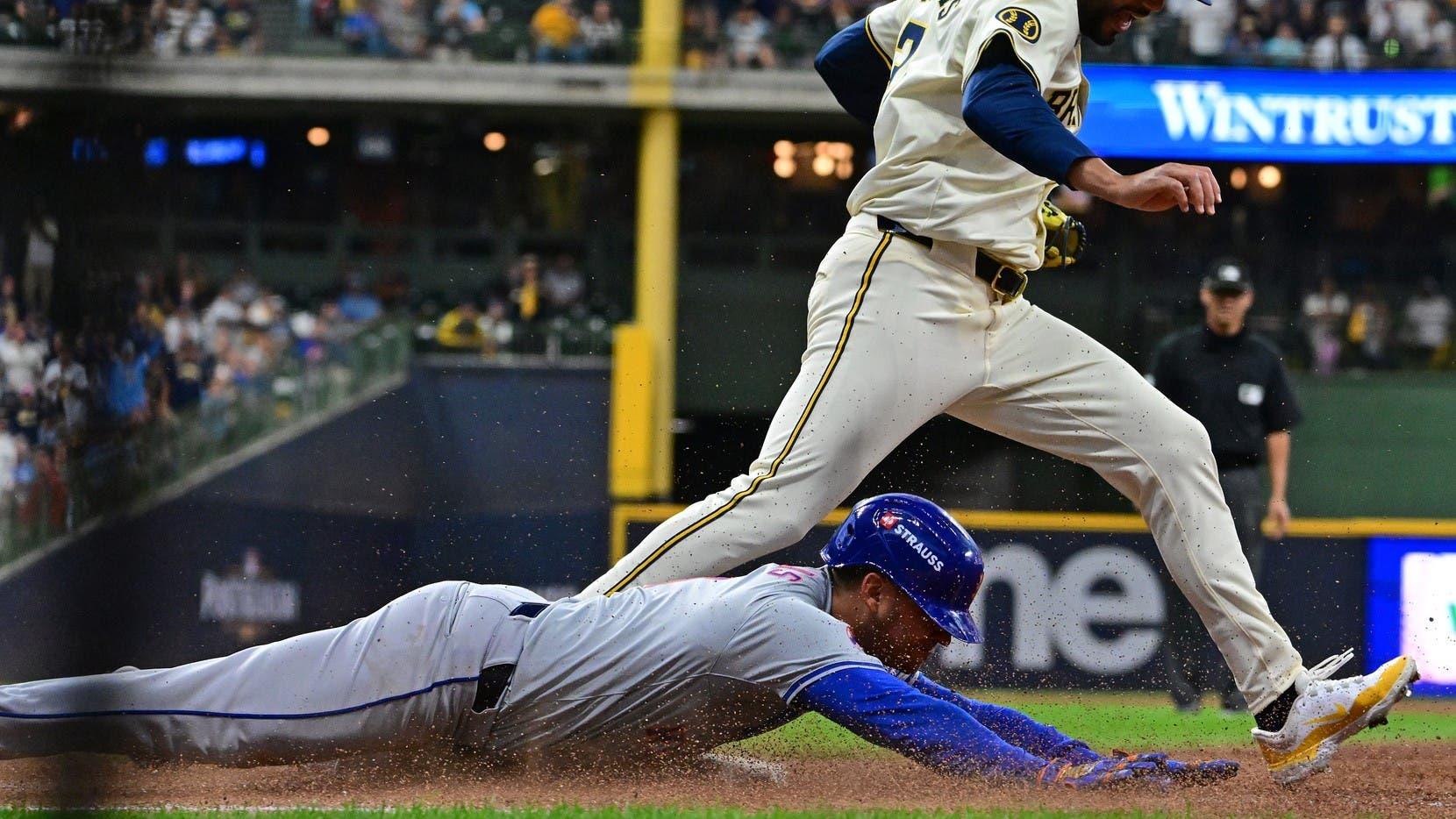 Jose Iglesias' head-first slide into first base sparks Mets' five-run inning in Game 1 win