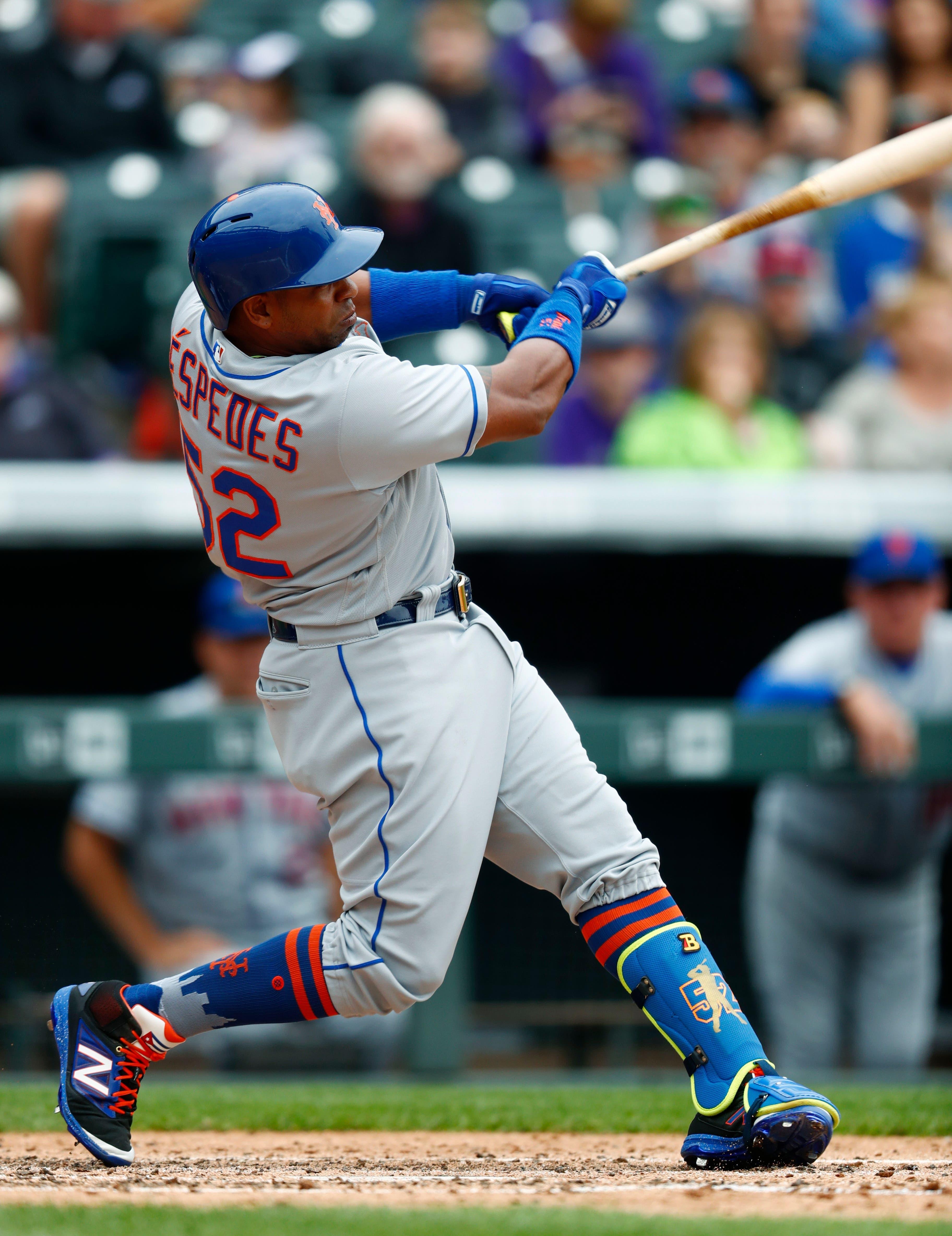 New York Mets' Yoenis Cespedes follows the flight of his solo home urn off Colorado Rockies starting pitcher German Marquez to lead off the top of the fourth inning of a baseball game Thursday, Aug. 3, 2017, in Denver. The Rockies won 5-4. (AP Photo/David Zalubowski) / David Zalubowski/AP