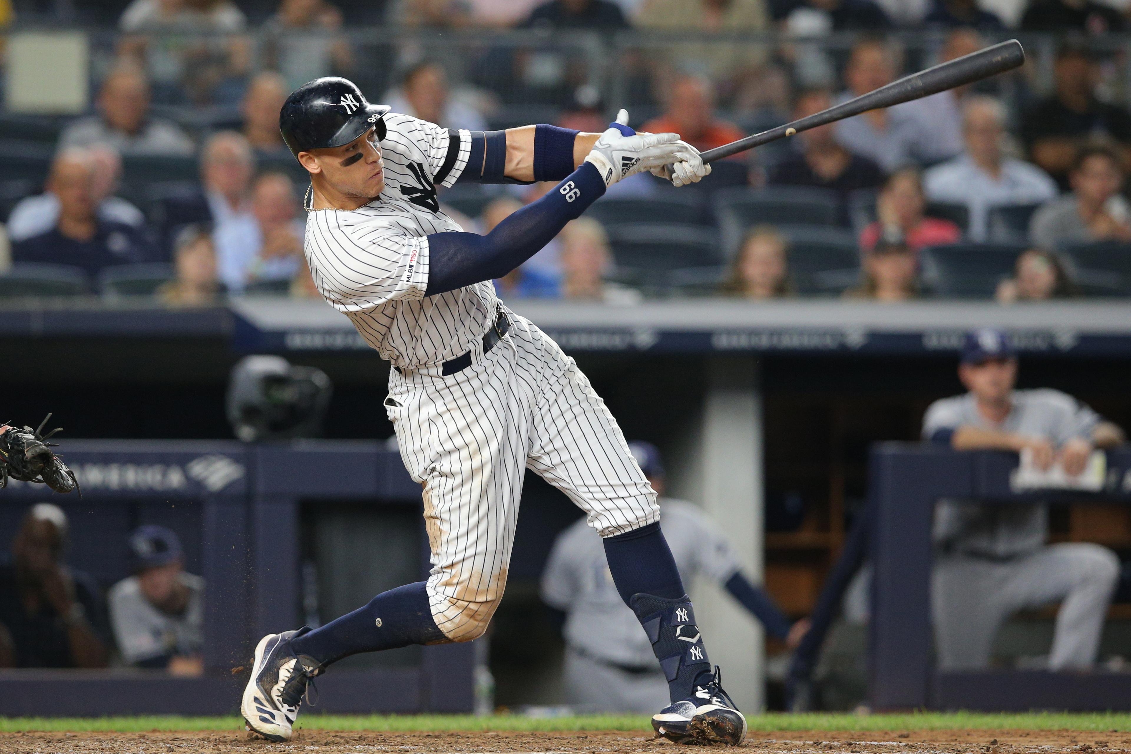 Jul 16, 2019; Bronx, NY, USA; New York Yankees right fielder Aaron Judge (99) hits a go ahead two run home run against the Tampa Bay Rays during the eighth inning at Yankee Stadium. Mandatory Credit: Brad Penner-USA TODAY Sports