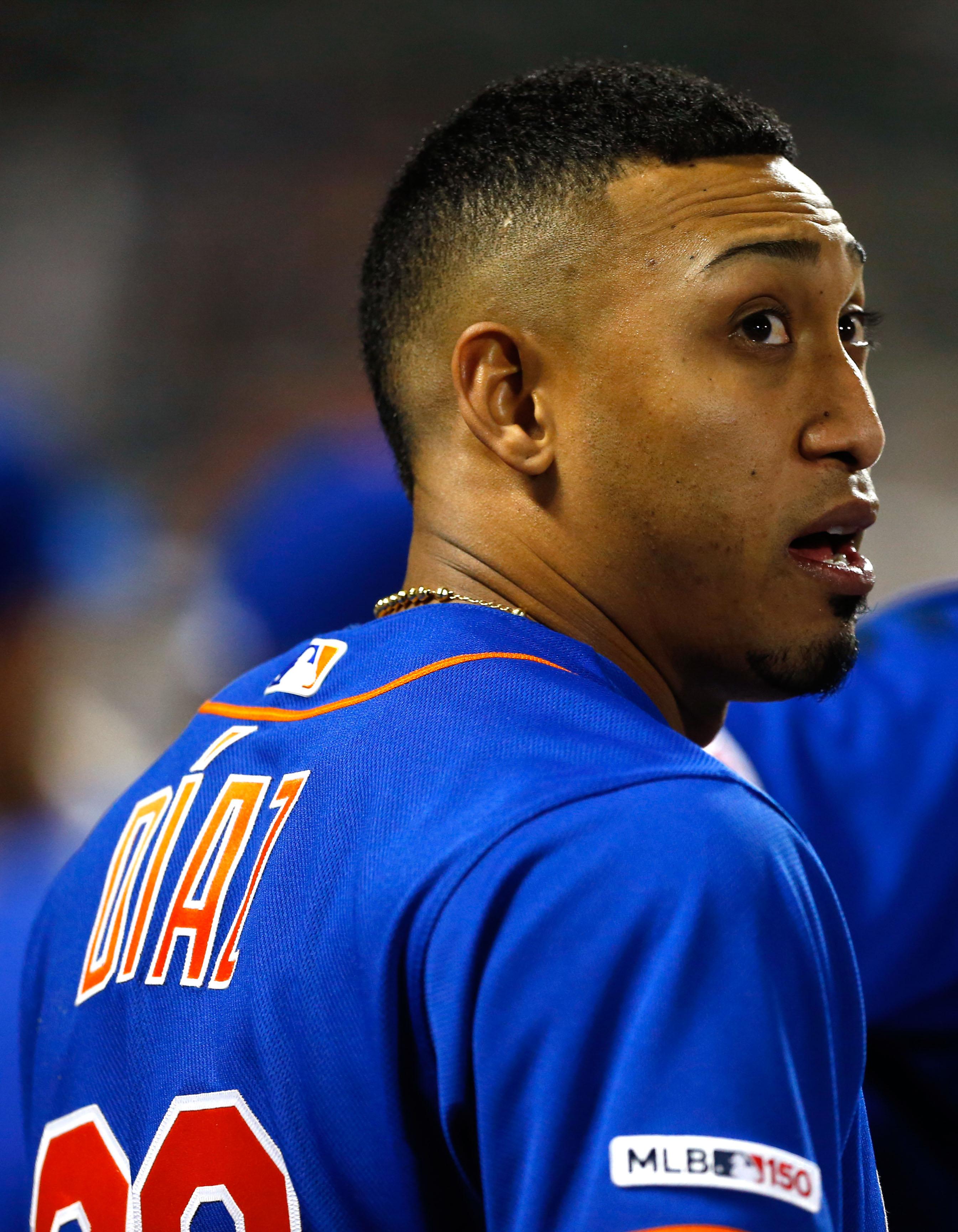 New York Mets relief pitcher Edwin Diaz watches play against the Washington Nationals from the dugout at Citi Field.