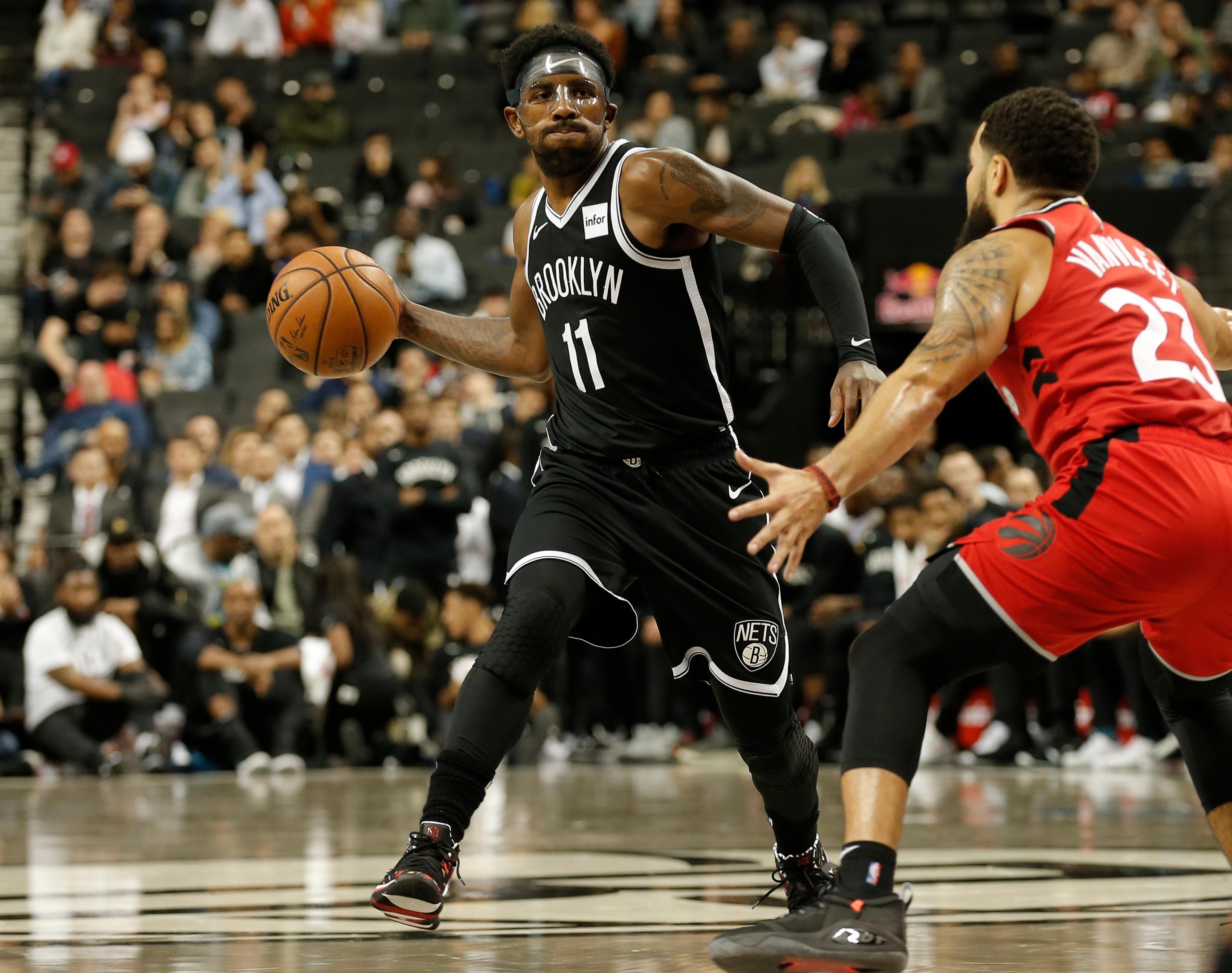 Oct 18, 2019; Brooklyn, NY, USA; Brooklyn Nets guard Kyrie Irving (11) moves the ball against Toronto Raptors guard Fred VanVleet (23) in the third quarter at Barclays Center. Mandatory Credit: Nicole Sweet-USA TODAY Sports