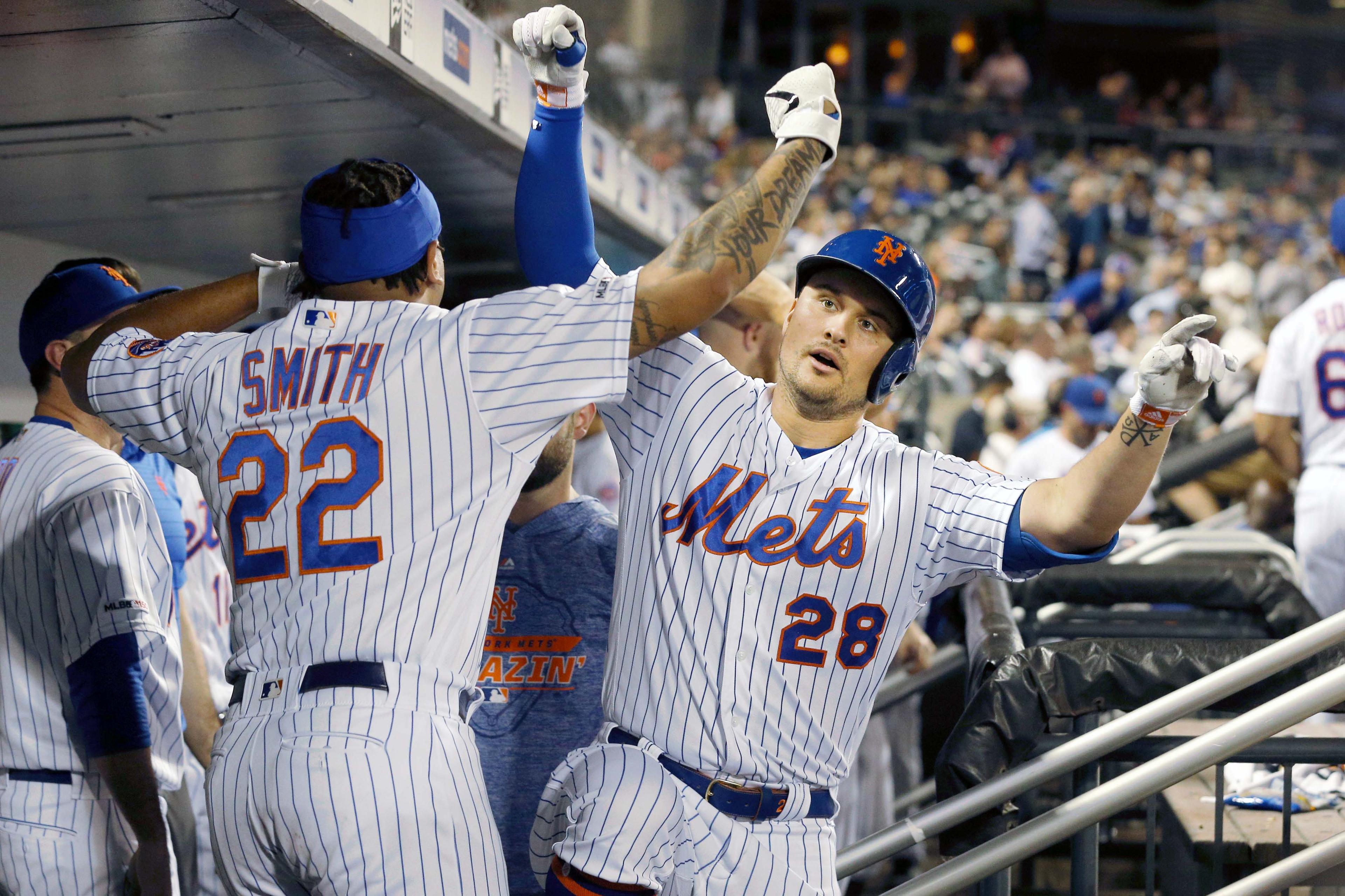 Jul 2, 2019; New York City, NY, USA; New York Mets left fielder J.D. Davis (28) celebrates his solo home run against the New York Yankees with left fielder Dominic Smith (22) during the sixth inning at Citi Field. Mandatory Credit: Brad Penner-USA TODAY Sports / Brad Penner