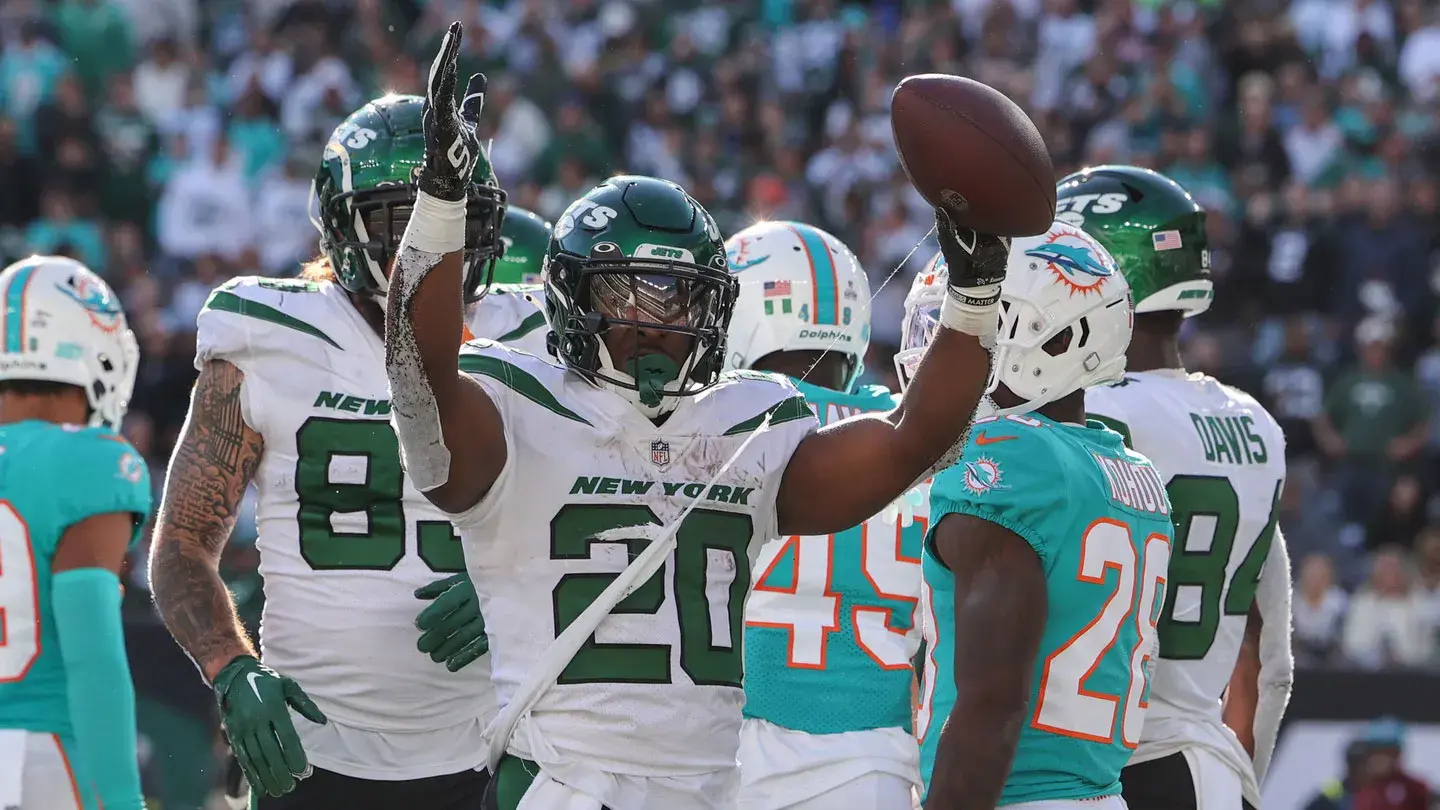 Oct 9, 2022; East Rutherford, New Jersey, USA; New York Jets running back Breece Hall (20) celebrates after scoring a touchdown against the Miami Dolphins during the second half at MetLife Stadium. / Ed Mulholland-USA TODAY Sports