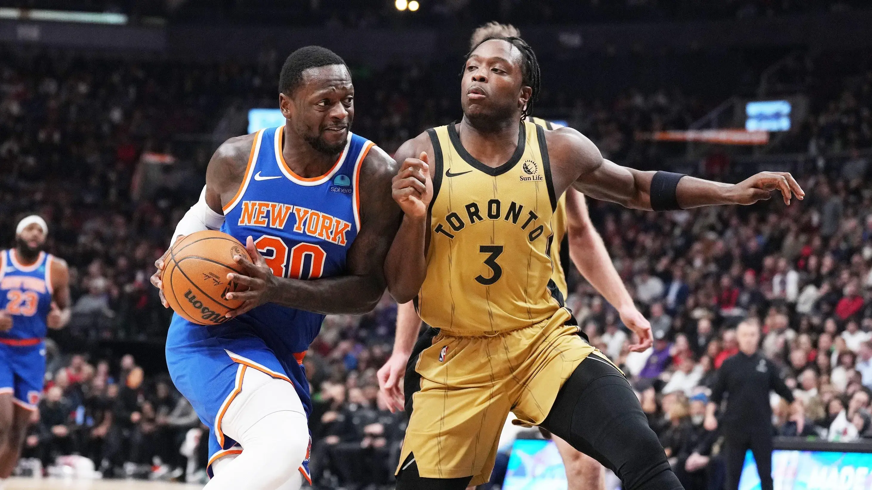 Dec 1, 2023; Toronto, Ontario, CAN; New York Knicks forward Julius Randle (30) controls the ball as Toronto Raptors forward O.G. Anunoby (3) tries to defend during the first quarter at Scotiabank Arena. / Nick Turchiaro-USA TODAY Sports