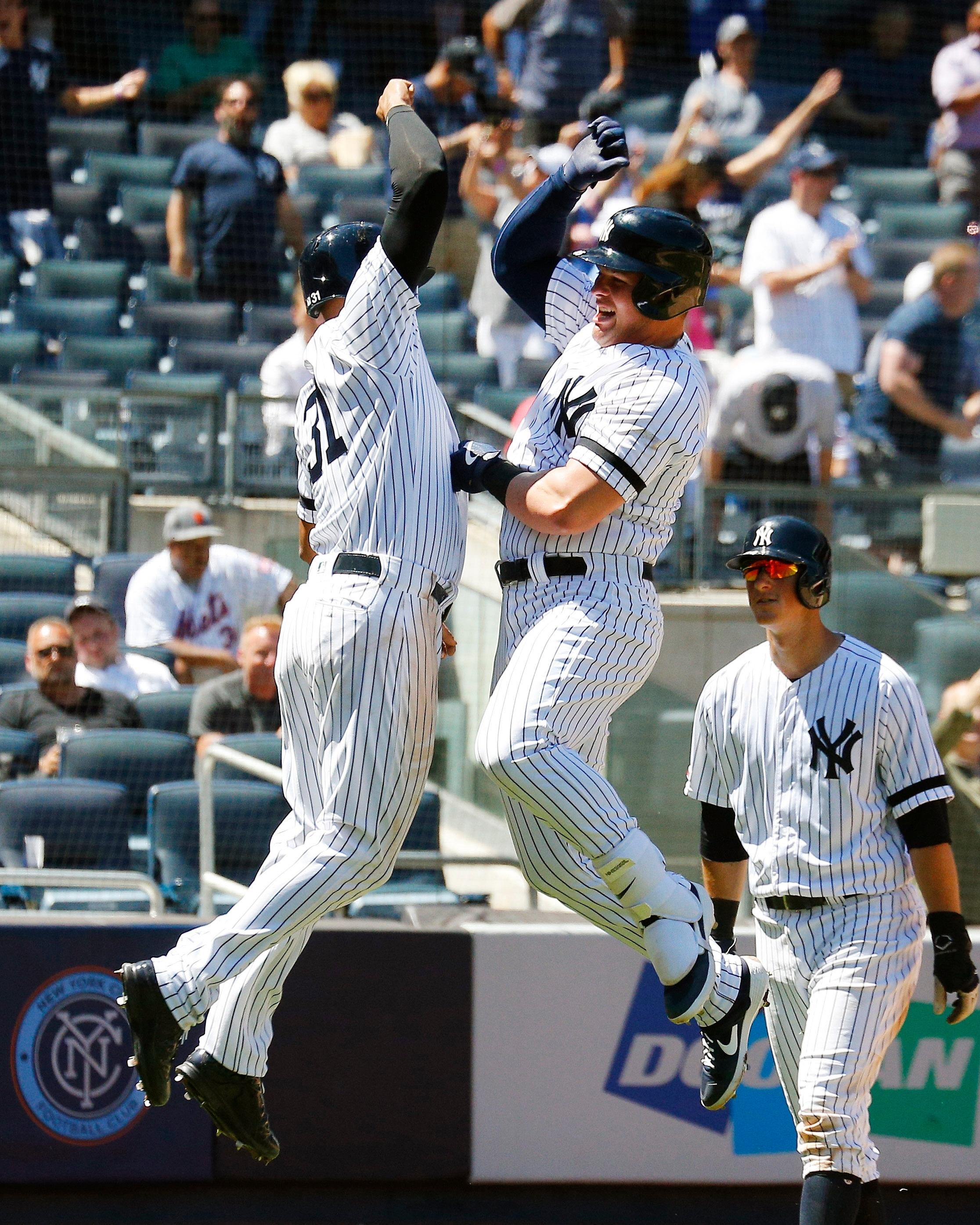 Jun 11, 2019; Bronx, NY, USA; New York Yankees designated hitter Luke Voit (45) reacts with center fielder Aaron Hicks (31) hitting a three run home run against the New York Mets during the fourth inning at Yankees Stadium. Mandatory Credit: Andy Marlin-USA TODAY Sports