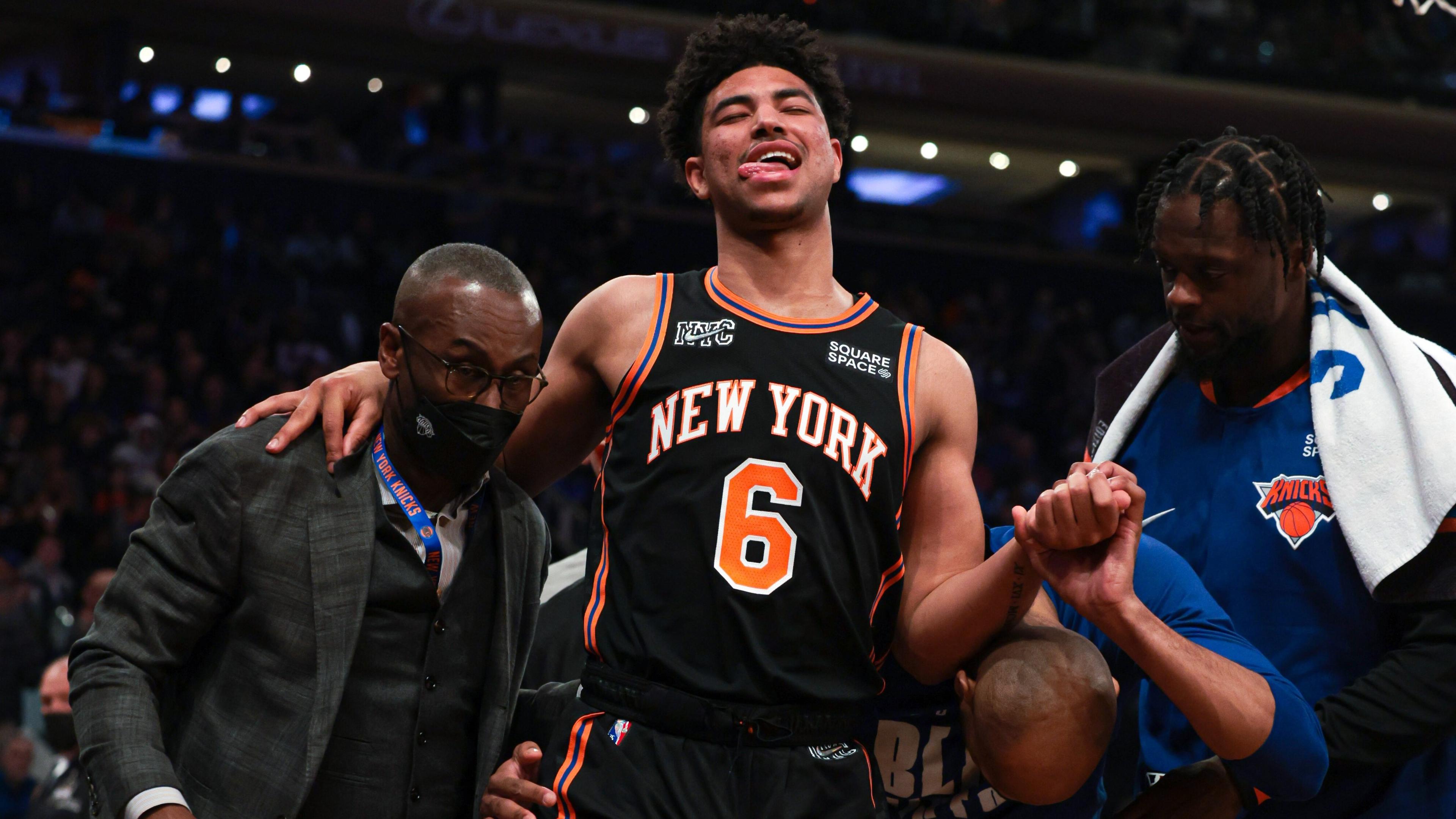 Feb 25, 2022; New York, New York, USA; New York Knicks guard Quentin Grimes (6) is helped off of the court by medical staff and forward Julius Randle (30) during the first half against the Miami Heat at Madison Square Garden. / Vincent Carchietta-USA TODAY Sports