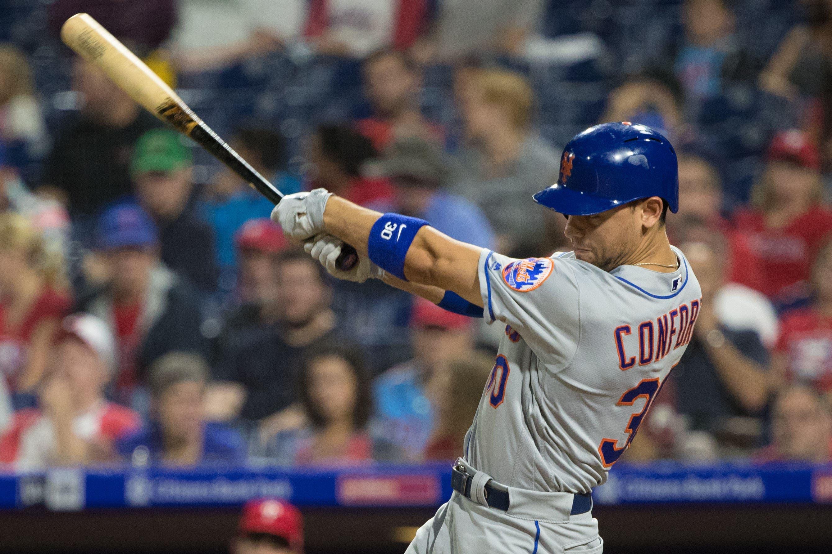 Sep 17, 2018; Philadelphia, PA, USA; New York Mets left fielder Michael Conforto (30) hits an RBI double during the seventh inning against the Philadelphia Phillies at Citizens Bank Park. Mandatory Credit: Bill Streicher-USA TODAY Sports / Bill Streicher