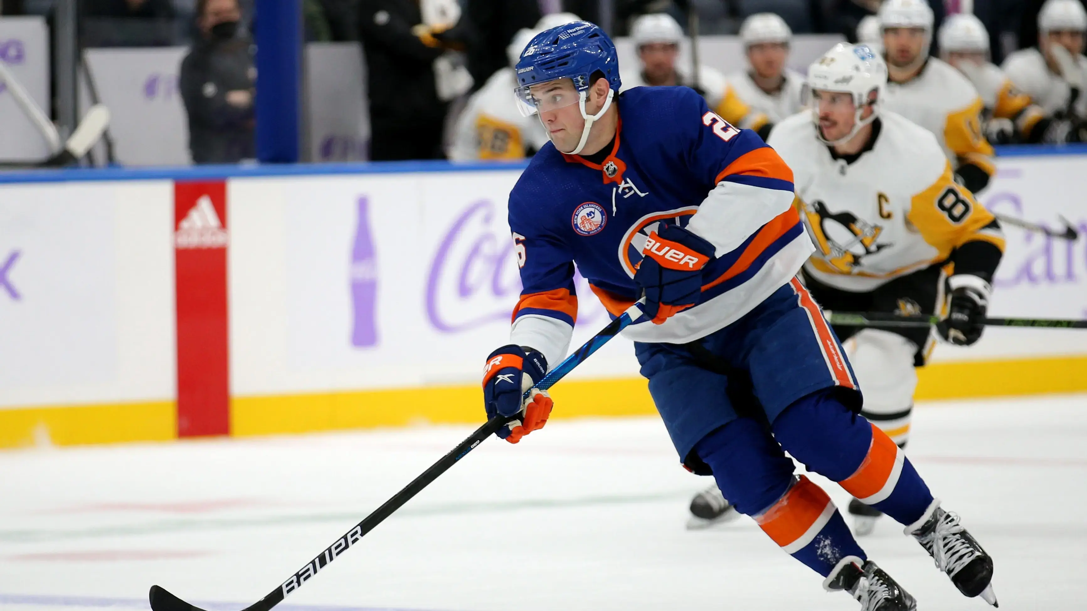 Nov 26, 2021; Elmont, New York, USA; New York Islanders right wing Oliver Wahlstrom (26) skates with the puck against the Pittsburgh Penguins during the second period at UBS Arena.