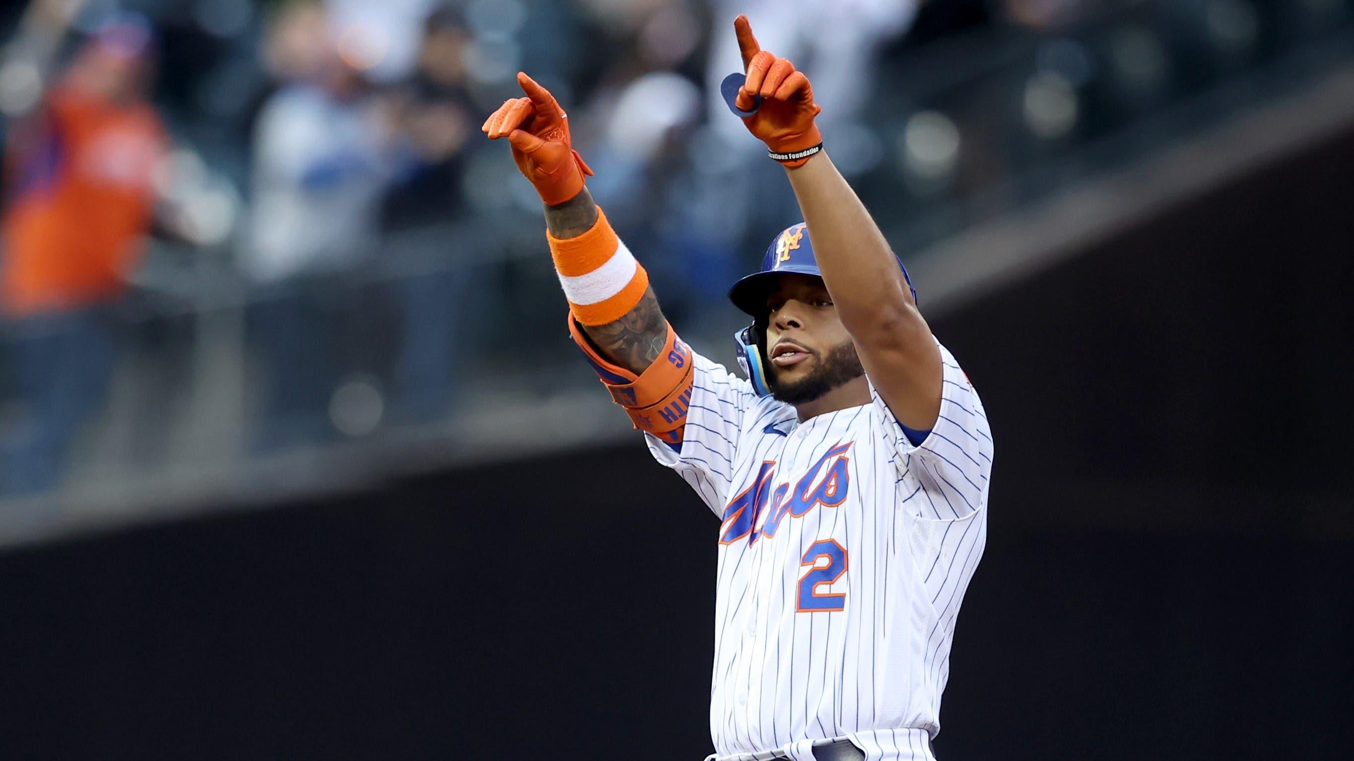 New York Mets first baseman Dominic Smith (2) reacts after hitting a two run double against the Atlanta Braves during the first inning at Citi Field. / Brad Penner-USA TODAY Sports