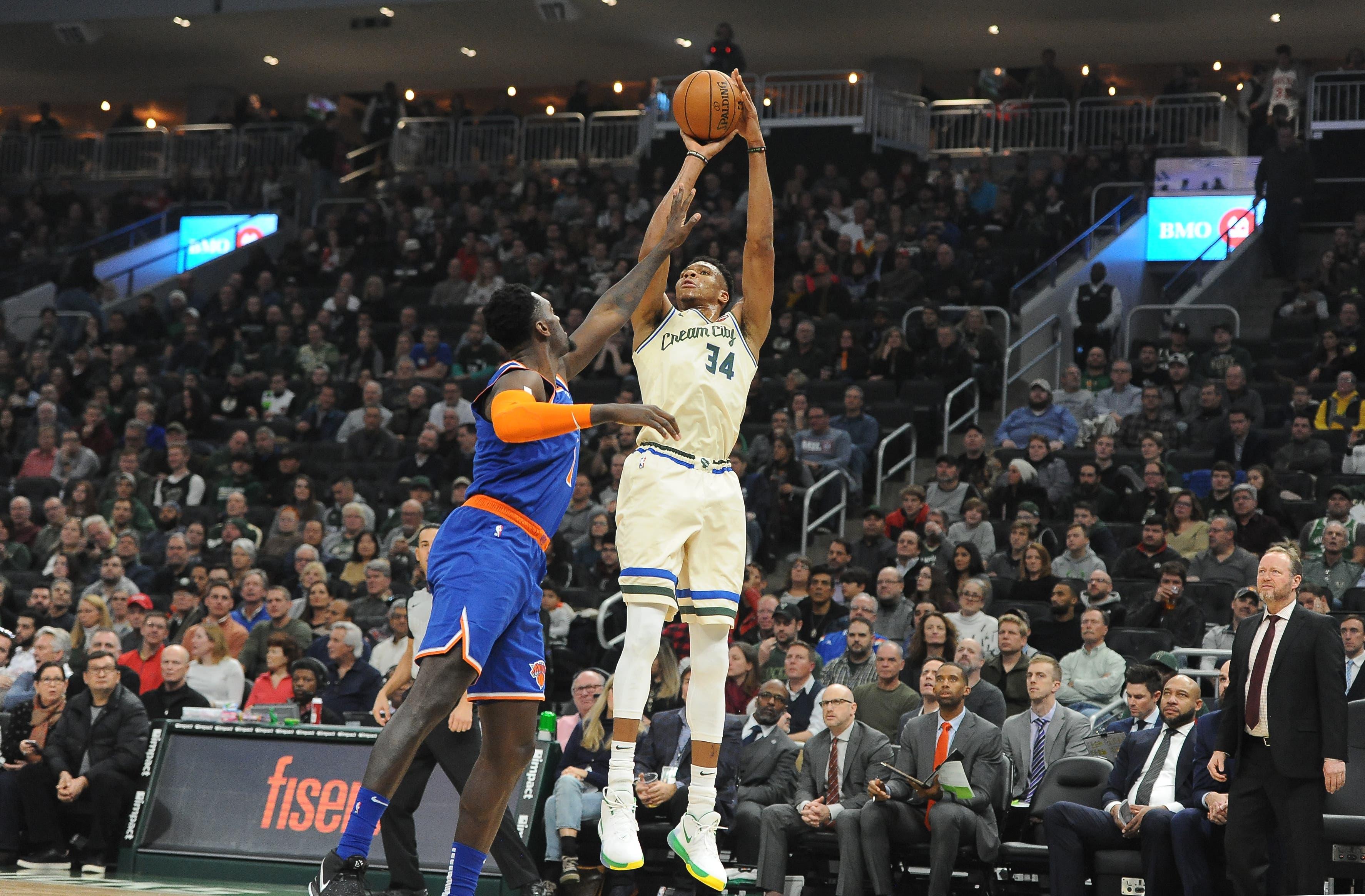 Dec 2, 2019; Milwaukee, WI, USA; Milwaukee Bucks forward Giannis Antetokounmpo (34) shoots over New York Knicks forward Bobby Portis (1) in the first quarter at Fiserv Forum. Mandatory Credit: Michael McLoone-USA TODAY Sports / Michael McLoone