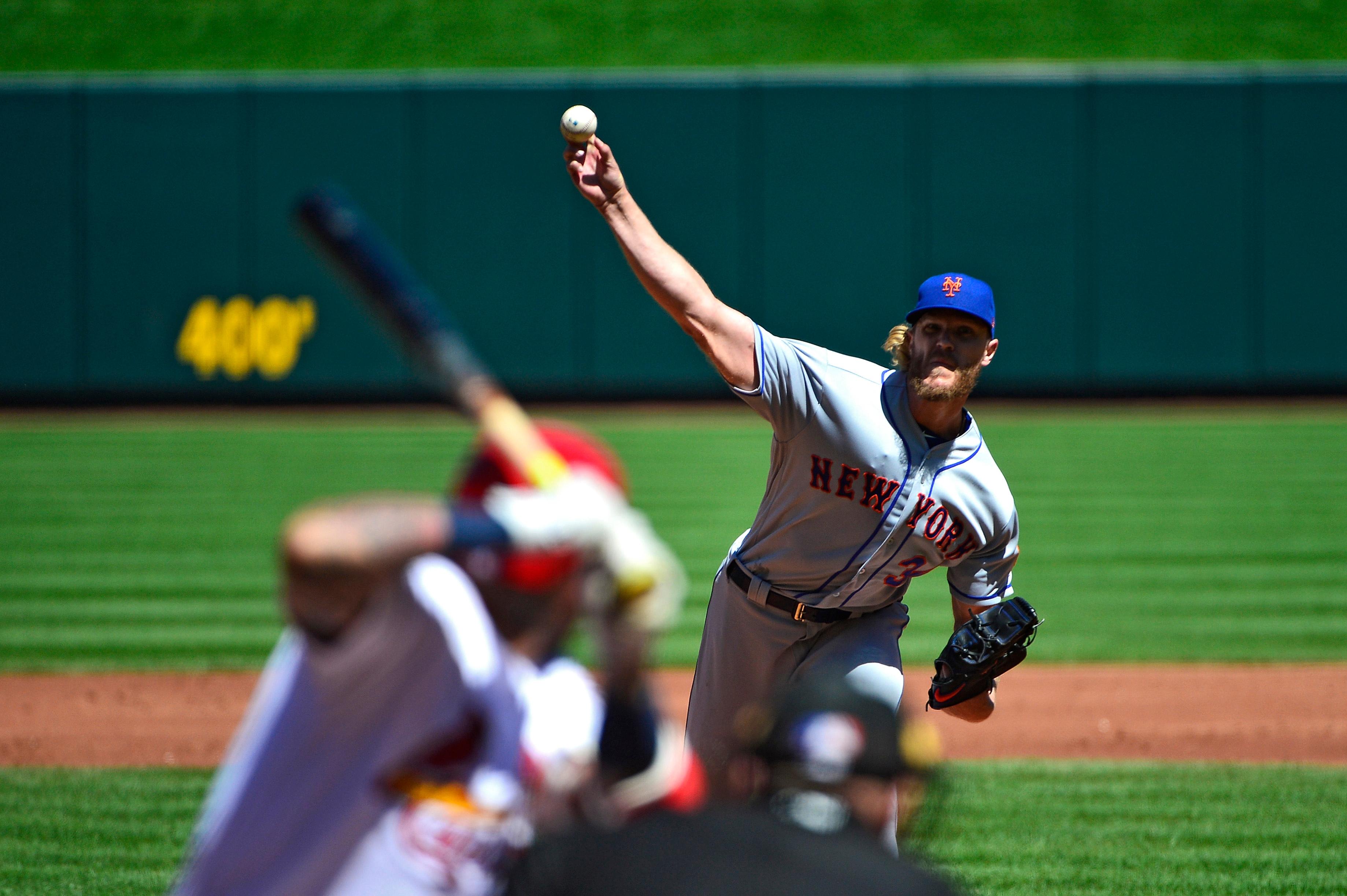 New York Mets starting pitcher Noah Syndergaard pitches to St. Louis Cardinals catcher Yadier Molina during the second inning at Busch Stadium.