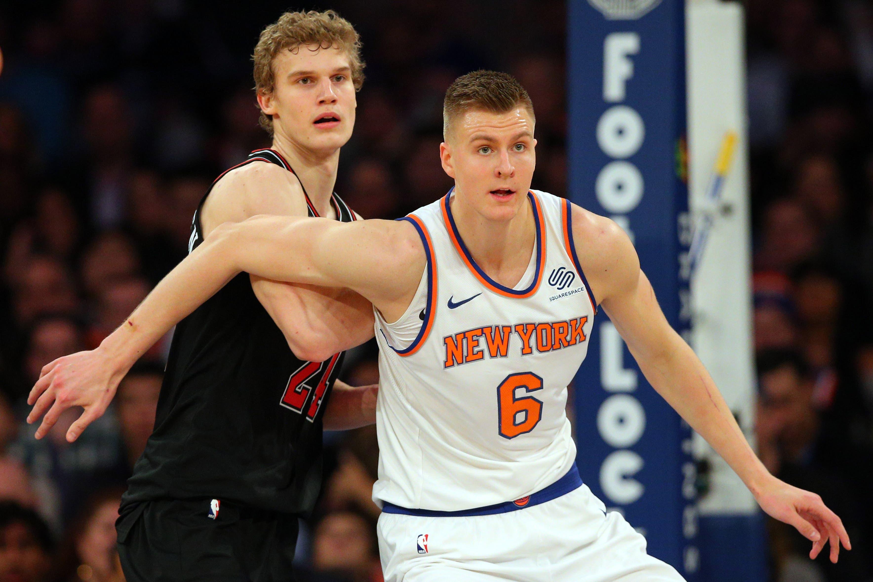 New York Knicks power forward Kristaps Porzingis and Chicago Bulls power forward Lauri Markkanen fight for position during the first quarter at Madison Square Garden. / Brad Penner/USA TODAY Sports