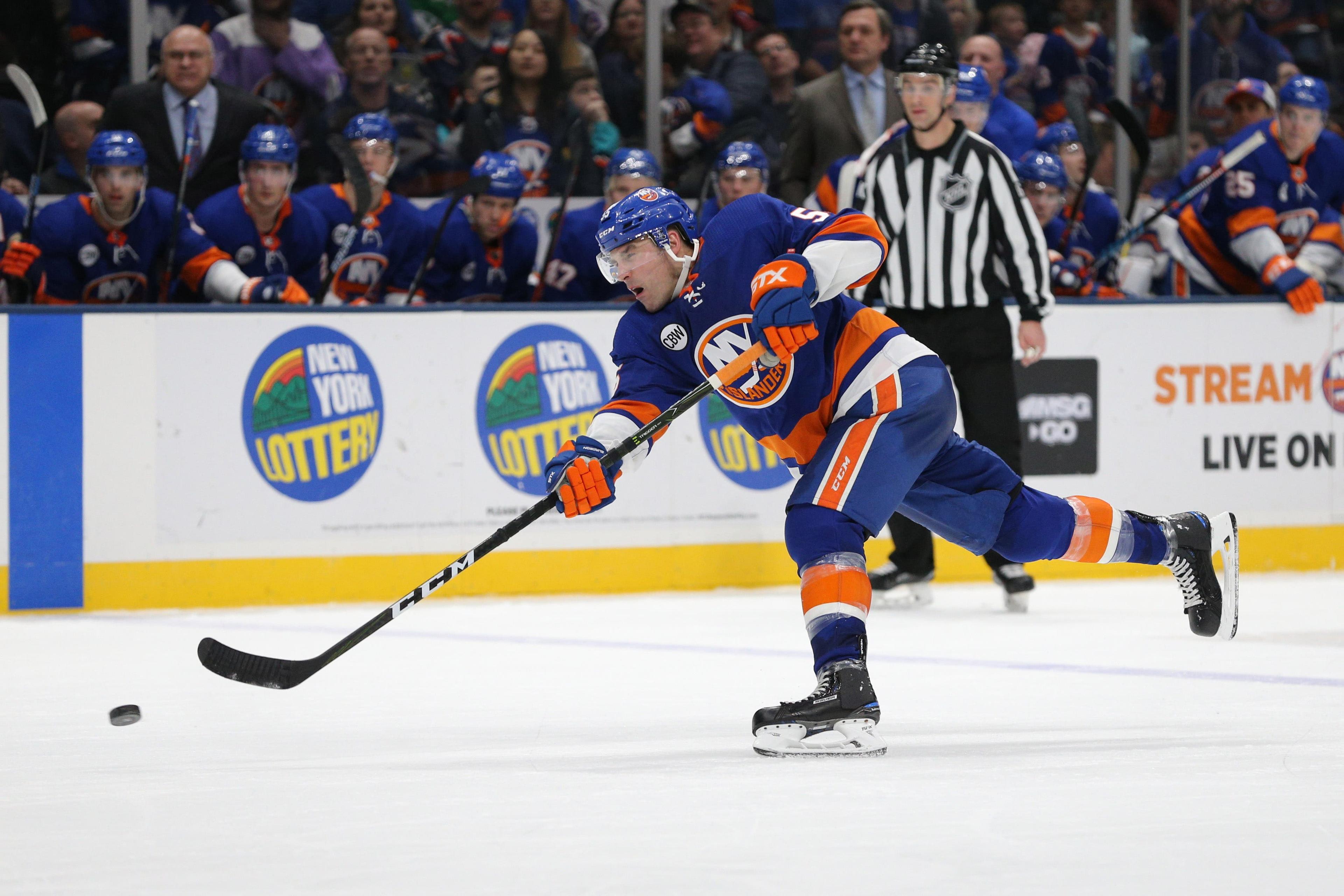 New York Islanders defenseman Johnny Boychuk shoots against the Arizona Coyotes during the second period at Nassau Veterans Memorial Coliseum. / Brad Penner/USA TODAY Sports