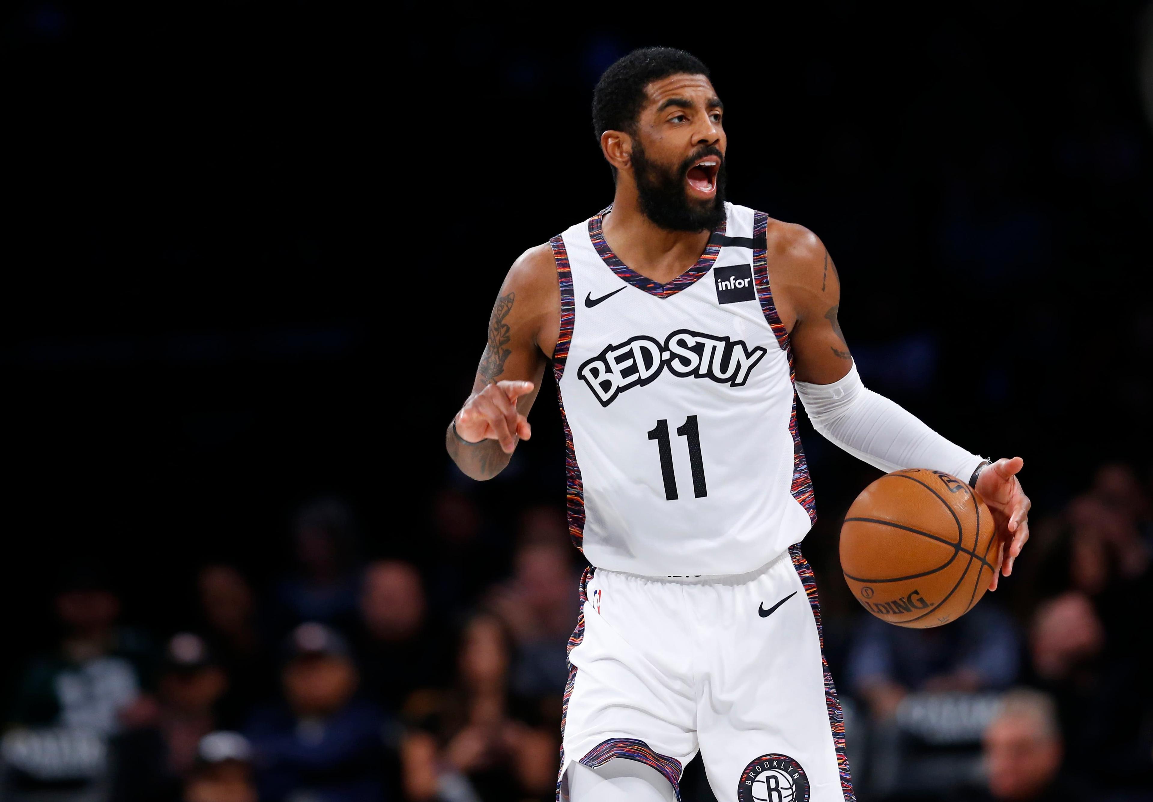 Jan 18, 2020; Brooklyn, New York, USA; Brooklyn Nets guard Kyrie Irving (11) dribbles the ball against the Milwaukee Bucks during the first half at Barclays Center. Mandatory Credit: Noah K. Murray-USA TODAY Sports / Noah K. Murray