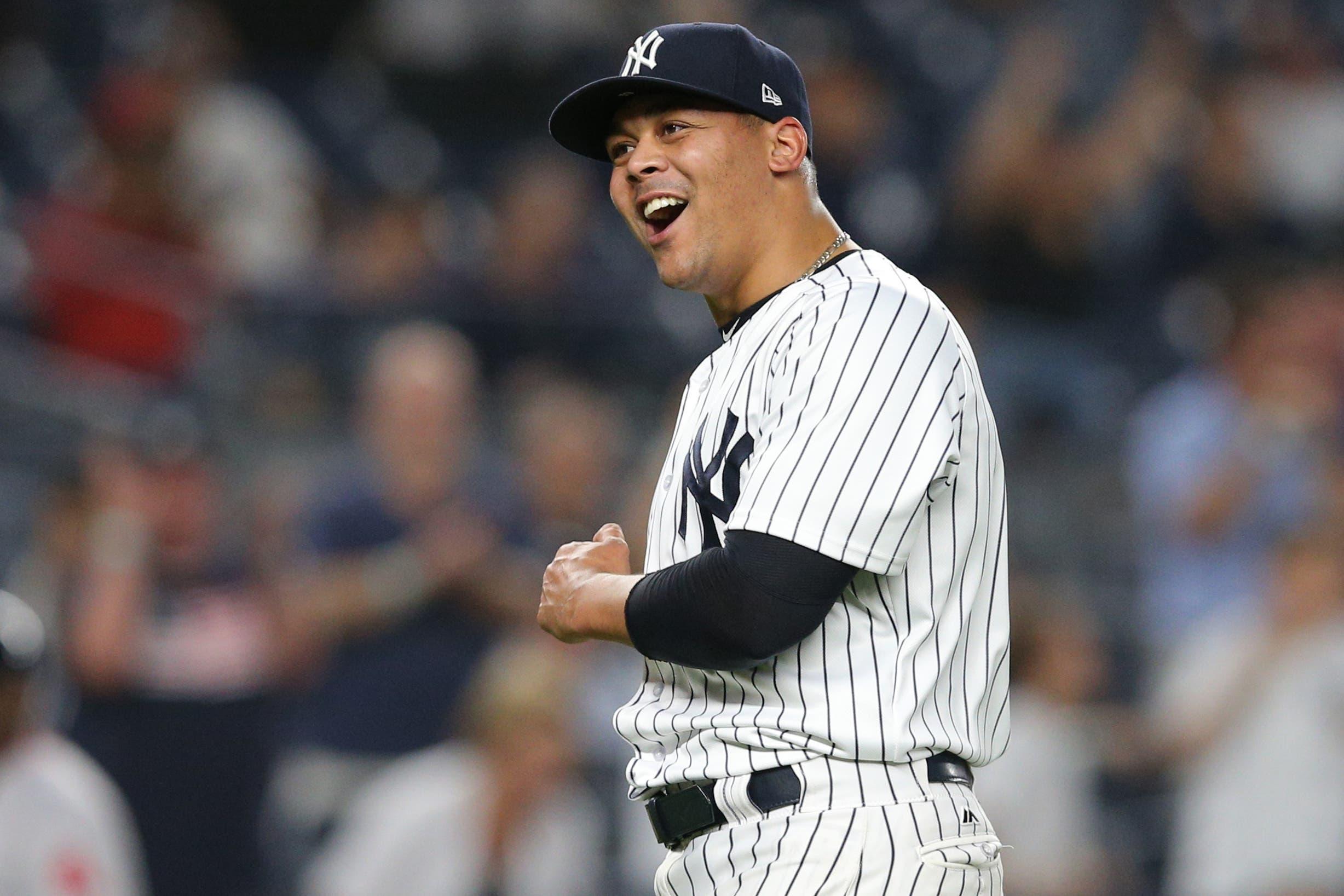 Sep 19, 2018; Bronx, NY, USA; New York Yankees relief pitcher Justus Sheffield (61) reacts after defeating the Boston Red Sox at Yankee Stadium. The appearance was Sheffield's major league debut. Mandatory Credit: Brad Penner-USA TODAY Sports / Brad Penner