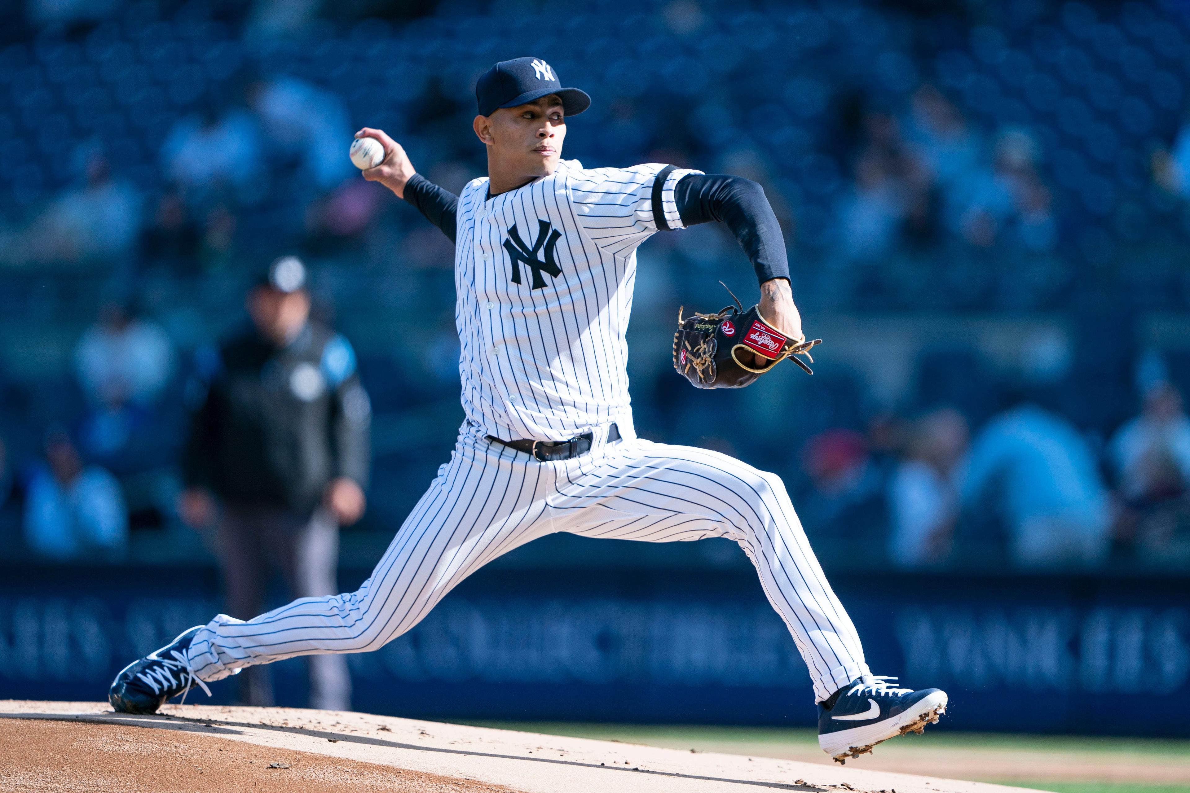 Apr 3, 2019; Bronx, NY, USA; New York Yankees pitcher Jonathan Loaisiga delivers a pitch during the first inning against the Detroit Tigers at Yankee Stadium. Mandatory Credit: Gregory J. Fisher-USA TODAY Sports / Gregory Fisher