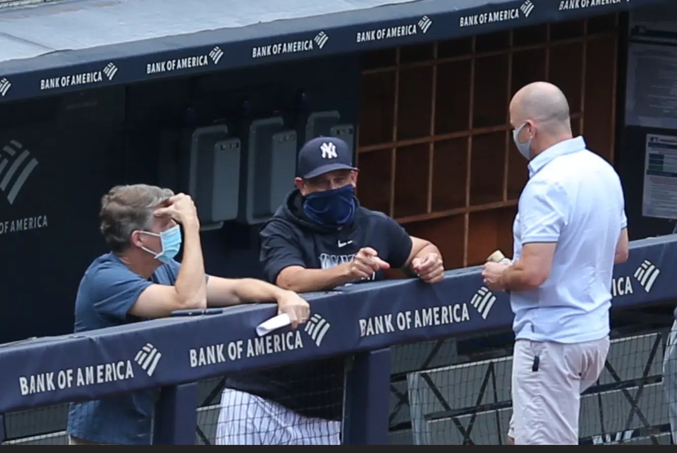 Jul 16, 2020; Bronx, New York, United States; New York Yankees general manager Brian Cashman (right) talks to owner Hal Steinbrenner (left) and manager Aaron Boone during summer camp workouts at Yankee Stadium. Mandatory Credit: Brad Penner-USA TODAY Sports / Brad Penner-USA TODAY Sports