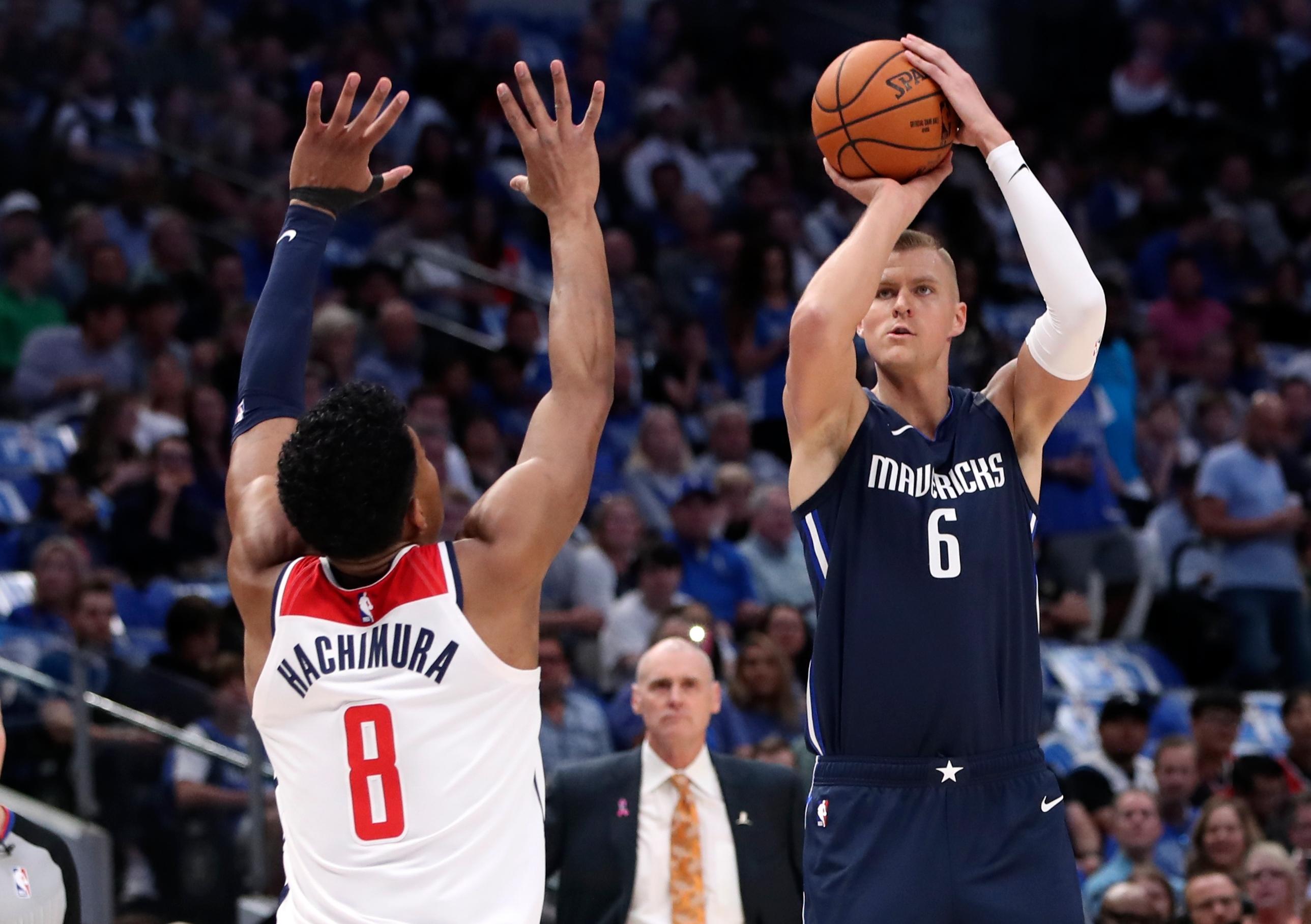 Oct 23, 2019; Dallas, TX, USA; Dallas Mavericks forward Kristaps Porzingis (6) shoots over Washington Wizards forward Rui Hachimura (8) during the first quarter at American Airlines Center. Mandatory Credit: Kevin Jairaj-USA TODAY Sports