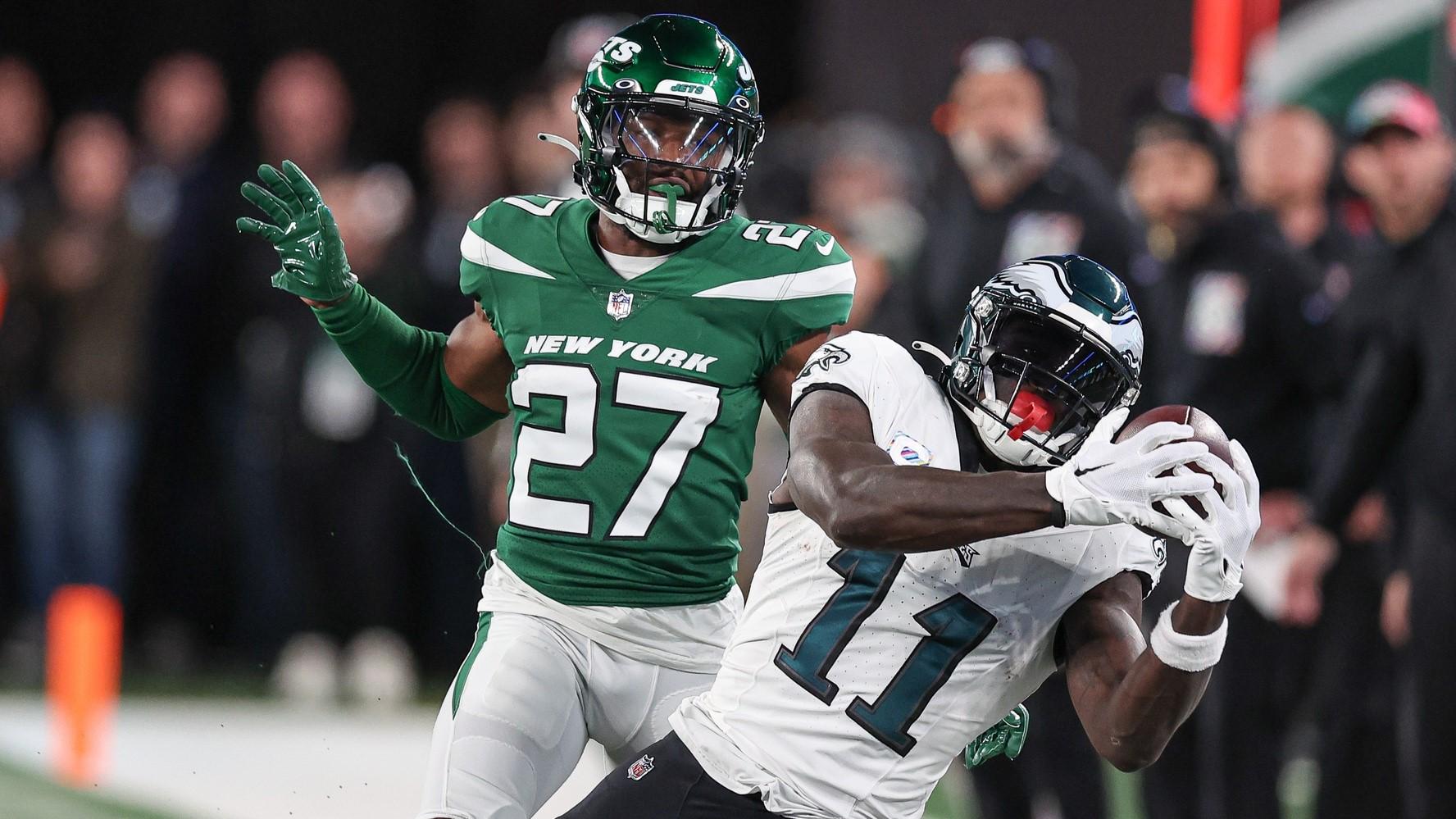 Oct 15, 2023; East Rutherford, New Jersey, USA; Philadelphia Eagles wide receiver A.J. Brown (11) catches the ball as New York Jets cornerback Tae Hayes (27) defends during the second half at MetLife Stadium. 