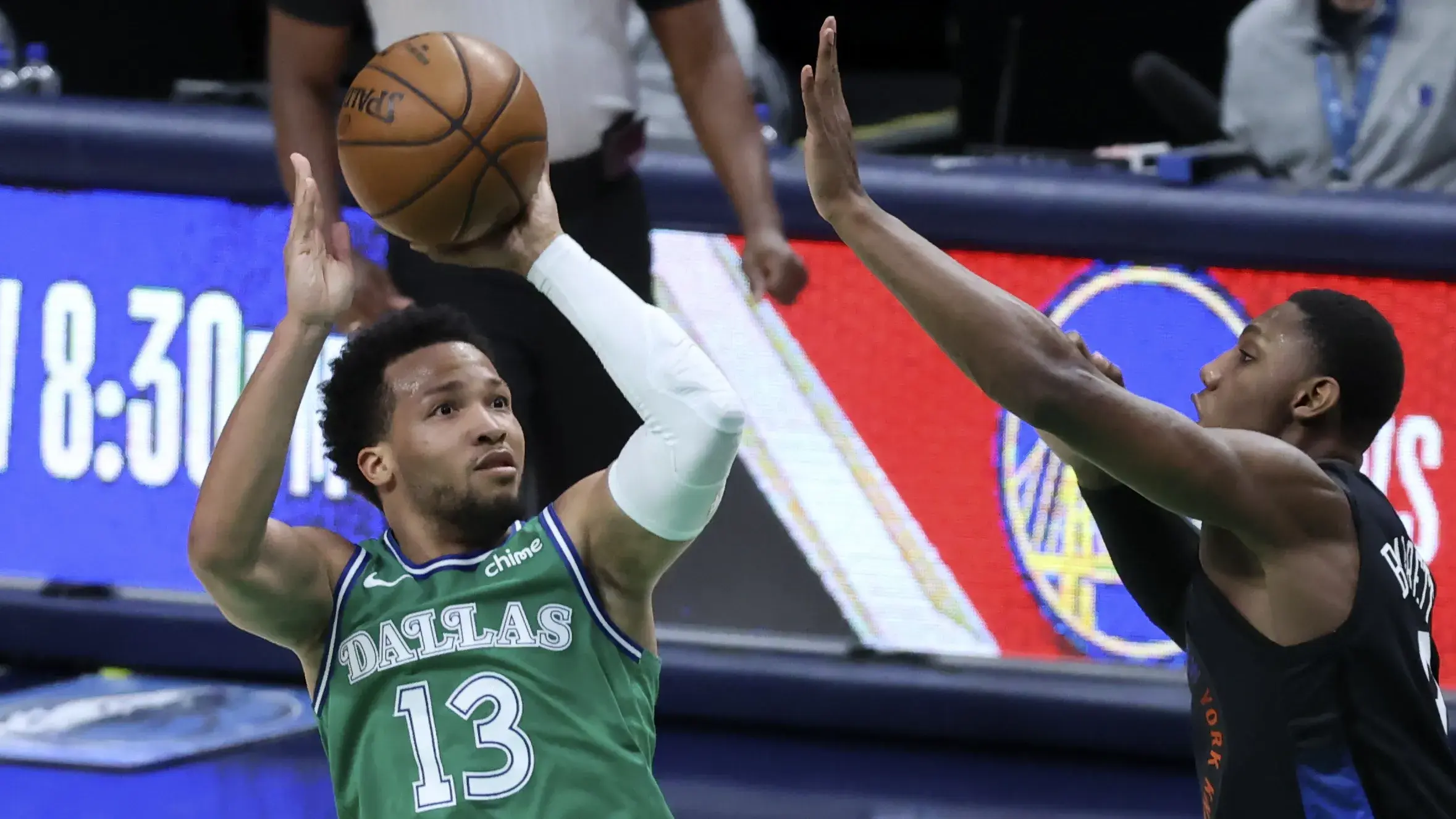 Apr 16, 2021; Dallas, Texas, USA; Dallas Mavericks guard Jalen Brunson (13) shoots over New York Knicks guard RJ Barrett (9) during the first quarter at American Airlines Center. Mandatory Credit: Kevin Jairaj-USA TODAY Sports / © Kevin Jairaj-USA TODAY Sports