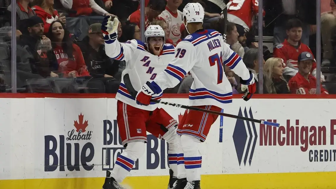 Mar 30, 2022; Detroit, Michigan, USA; New York Rangers center Andrew Copp (18) celebrates with defenseman K Andre Miller (79) after scoring in overtime against the Detroit Red Wings at Little Caesars Arena. / Rick Osentoski-USA TODAY Sports