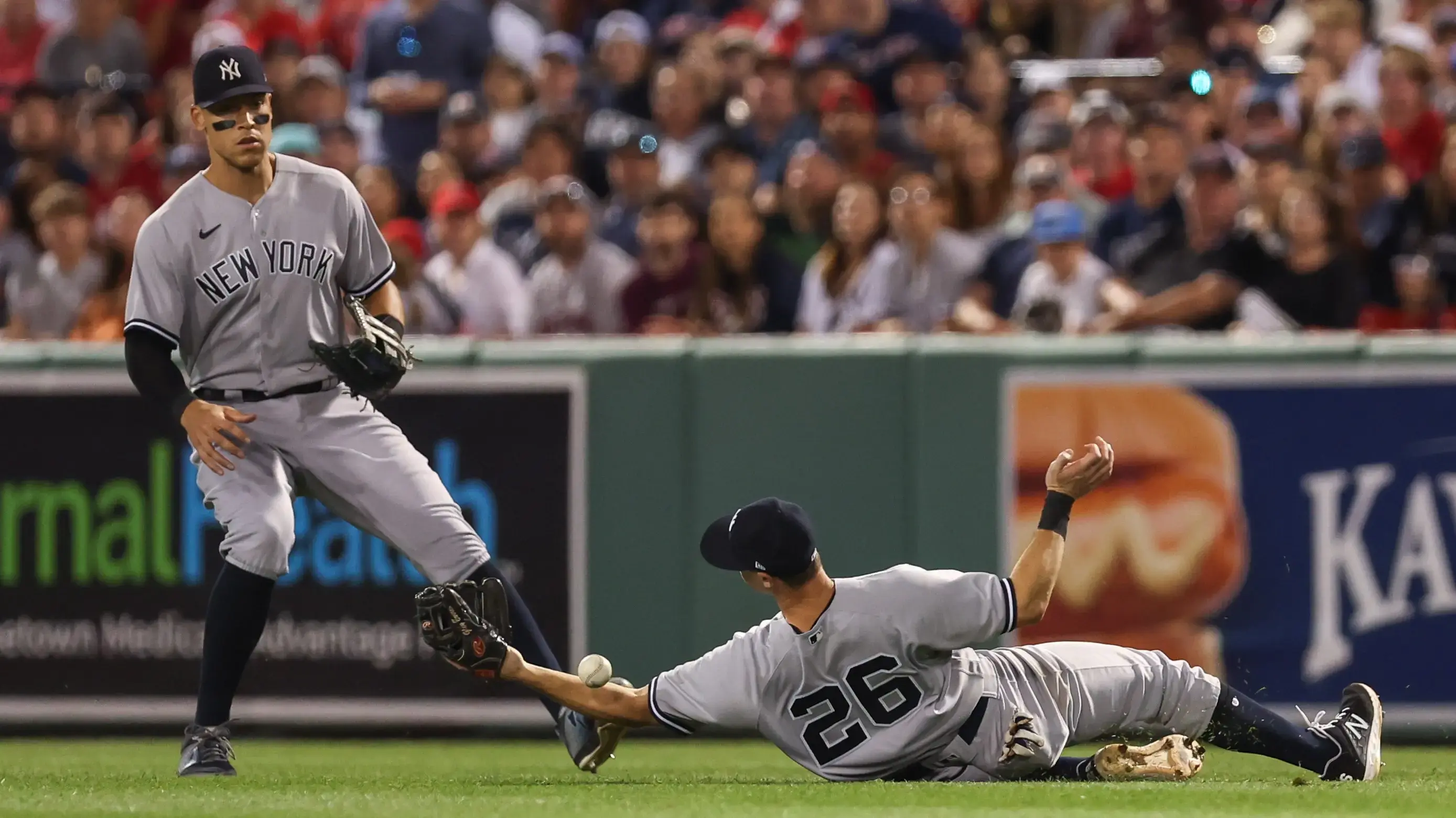 Jul 10, 2022; Boston, Massachusetts, USA; New York Yankees second baseman DJ LeMahieu (26) drops a fly ball during the sixth inning against the Boston Red Sox at Fenway Park. Mandatory Credit: Paul Rutherford-USA TODAY Sports / Paul Rutherford-USA TODAY Sports