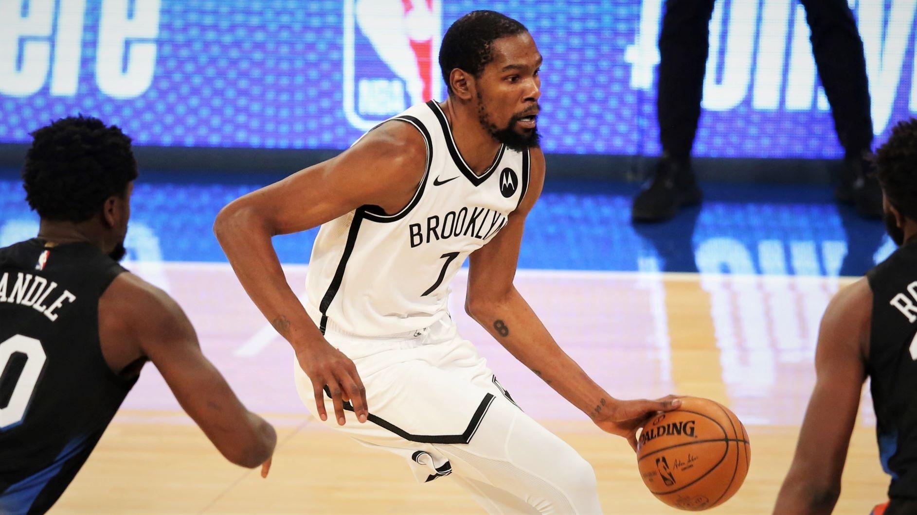 Jan 13, 2021; New York, New York, USA; Brooklyn Nets forward Kevin Durant (7) dribbles the ball against New York Knicks power forward Julius Randle (30) and center Mitchell Robinson (23) during the first quarter at Madison Square Garden. Mandatory Credit: Brad Penner-USA TODAY Sports / © Brad Penner-USA TODAY Sports