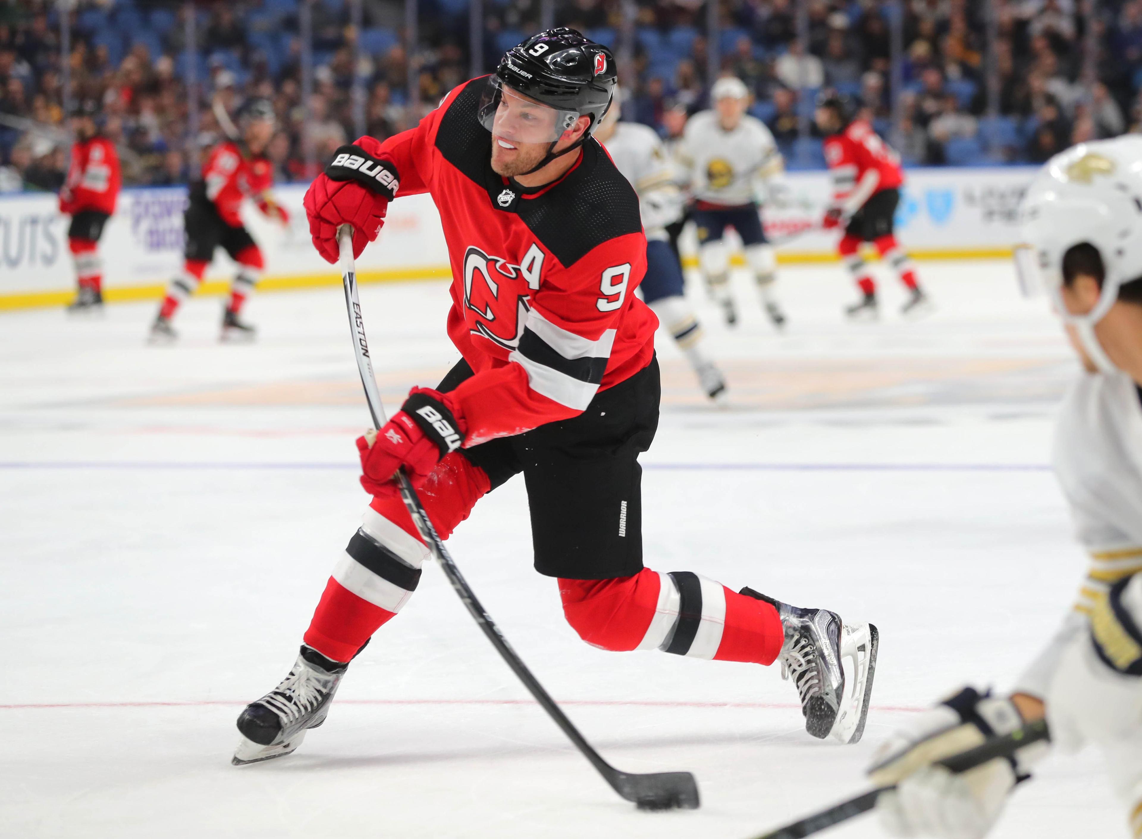 Dec 2, 2019; Buffalo, NY, USA; New Jersey Devils left wing Taylor Hall (9) takes a shot on goal during the third period against the Buffalo Sabres at KeyBank Center. Mandatory Credit: Timothy T. Ludwig-USA TODAY Sports / Timothy T. Ludwig