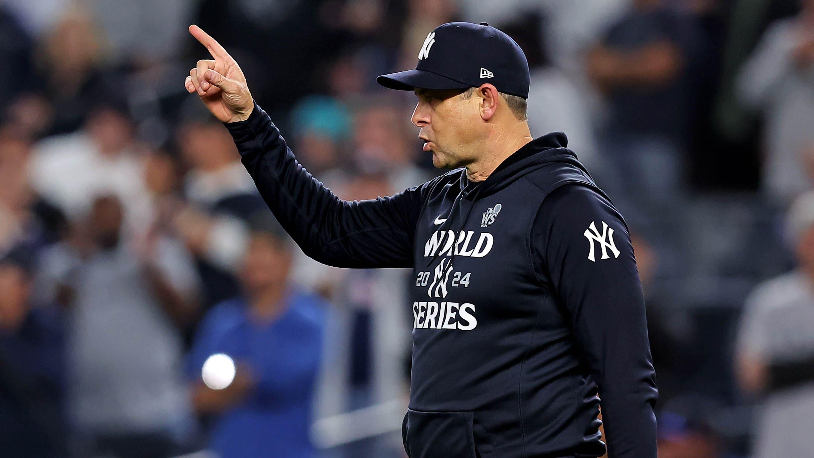 New York Yankees manager Aaron Boone (17) signals to the bull pen for a pitching change during the seventh inning against the Los Angeles Dodgers in game four of the 2024 MLB World Series at Yankee Stadium / Brad Penner - Imagn Images