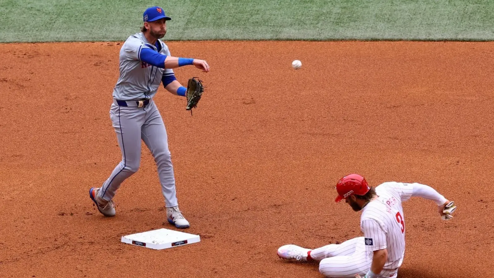 [US, Mexico & Canada customers only] June 9, 2024; London, UNITED KINGDOM; New York Mets infielder Jeff McNeil forces out Philadelphia Phillies player Bryce Harper during a London Series baseball game at Queen Elizabeth Olympic Park. / Matthew Childs/Reuters via USA TODAY Sports