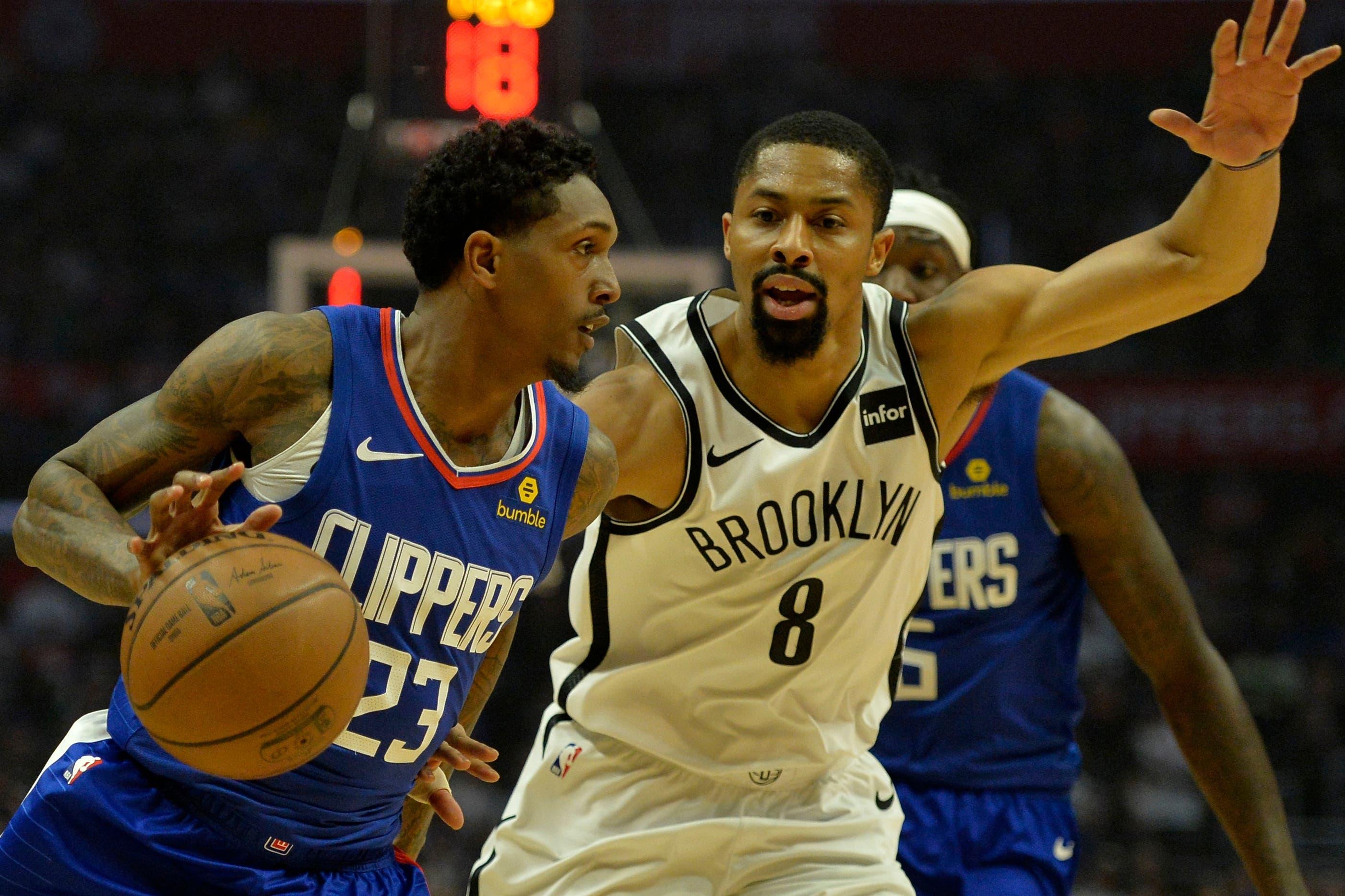 LA Clippers guard Lou Williams dribbles defended by Brooklyn Nets guard Spencer Dinwiddie during the first quarter at Staples Center. / Jake Roth/USA TODAY Sports