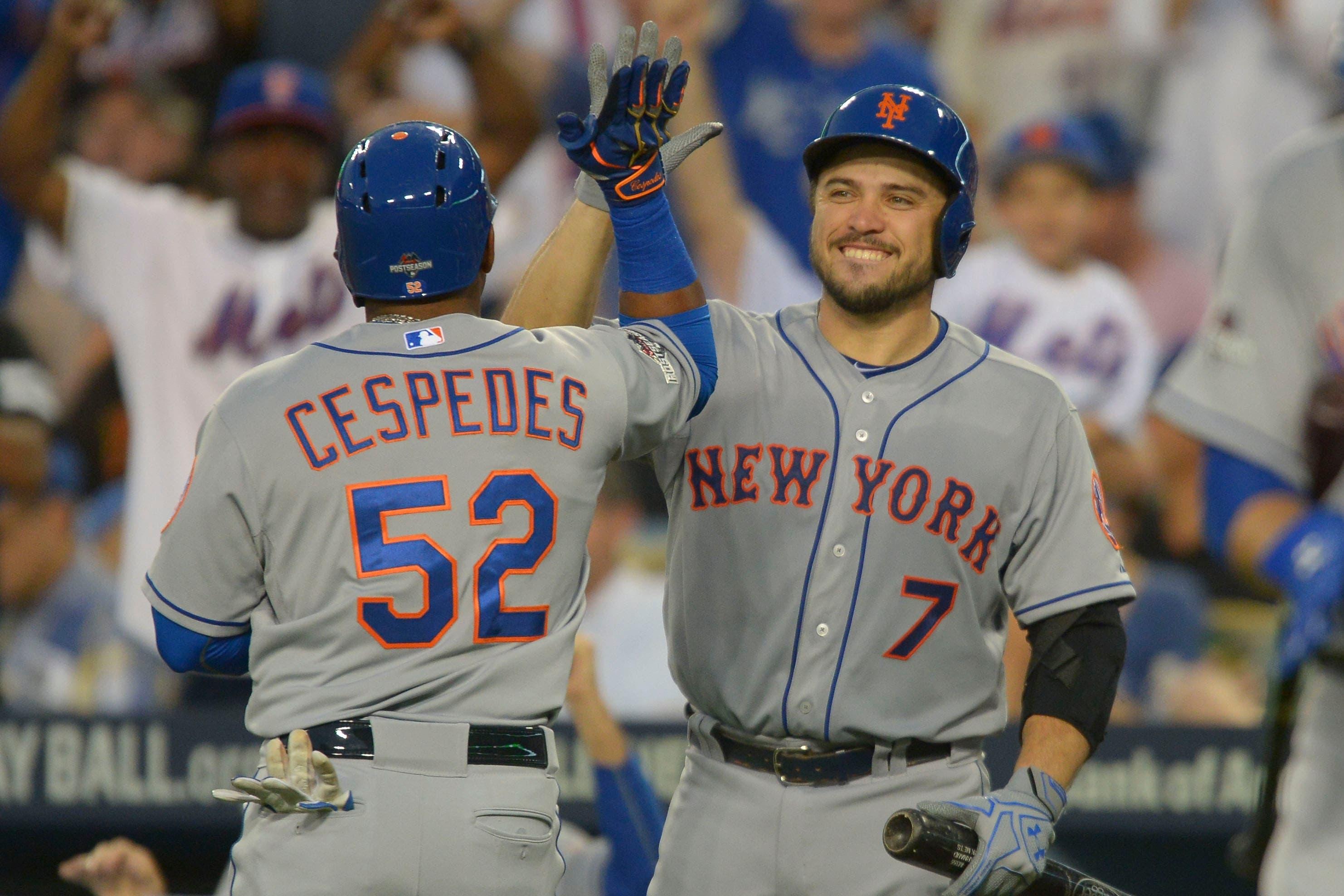 Oct 10, 2015; Los Angeles, CA, USA; New York Mets center fielder Yoenis Cespedes (52) is congratulated by catcher Travis d'Arnaud (7) for hitting a solo home run during the second inning in game two of the NLDS against the Los Angeles Dodgers at Dodger Stadium. Mandatory Credit: Jayne Kamin-Oncea-USA TODAY Sports / Jayne Kamin-Oncea