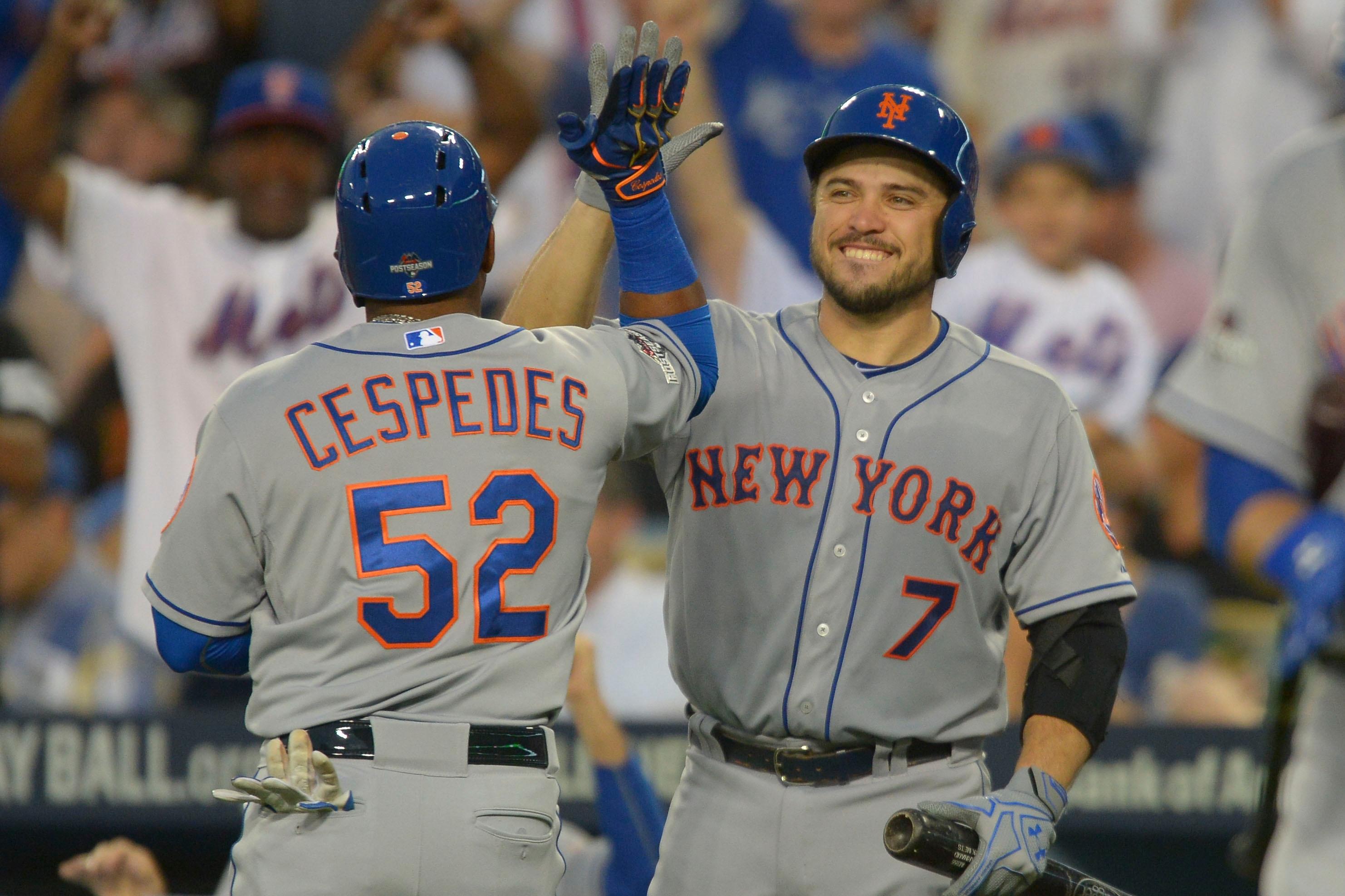 Oct 10, 2015; Los Angeles, CA, USA; New York Mets center fielder Yoenis Cespedes (52) is congratulated by catcher Travis d'Arnaud (7) for hitting a solo home run during the second inning in game two of the NLDS against the Los Angeles Dodgers at Dodger Stadium. Mandatory Credit: Jayne Kamin-Oncea-USA TODAY Sports