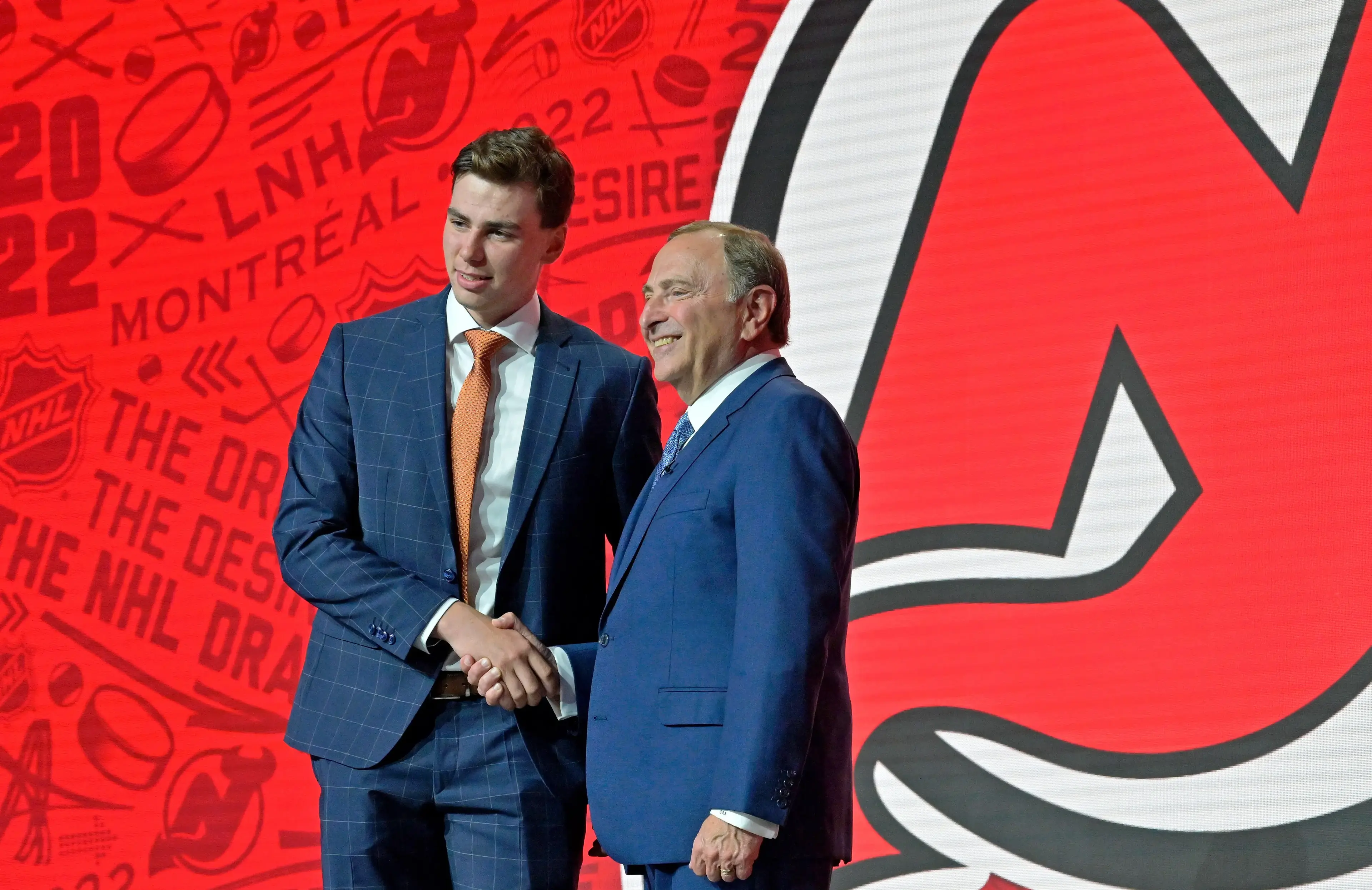 Simon Nemec shakes hands with NHL commissioner Gary Bettman after being selected as the number two overall pick to the New Jersey Devils in the first round of the 2022 NHL Draft at Bell Centre. / Eric Bolte-USA TODAY Sports