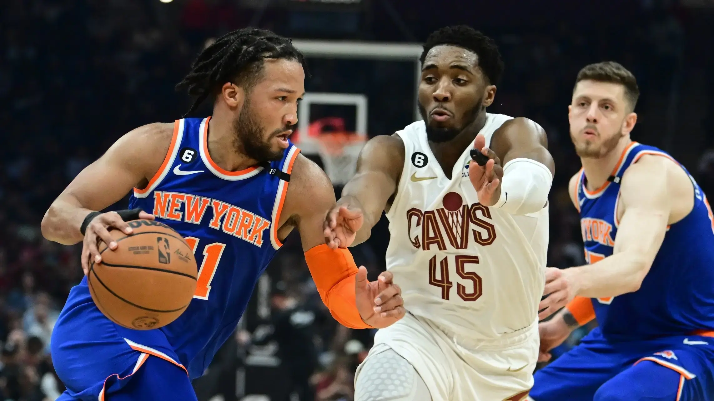 Mar 31, 2023; Cleveland, Ohio, USA; New York Knicks guard Jalen Brunson (11) drives to the basket against Cleveland Cavaliers guard Donovan Mitchell (45) during the first half at Rocket Mortgage FieldHouse. / Ken Blaze-USA TODAY Sports
