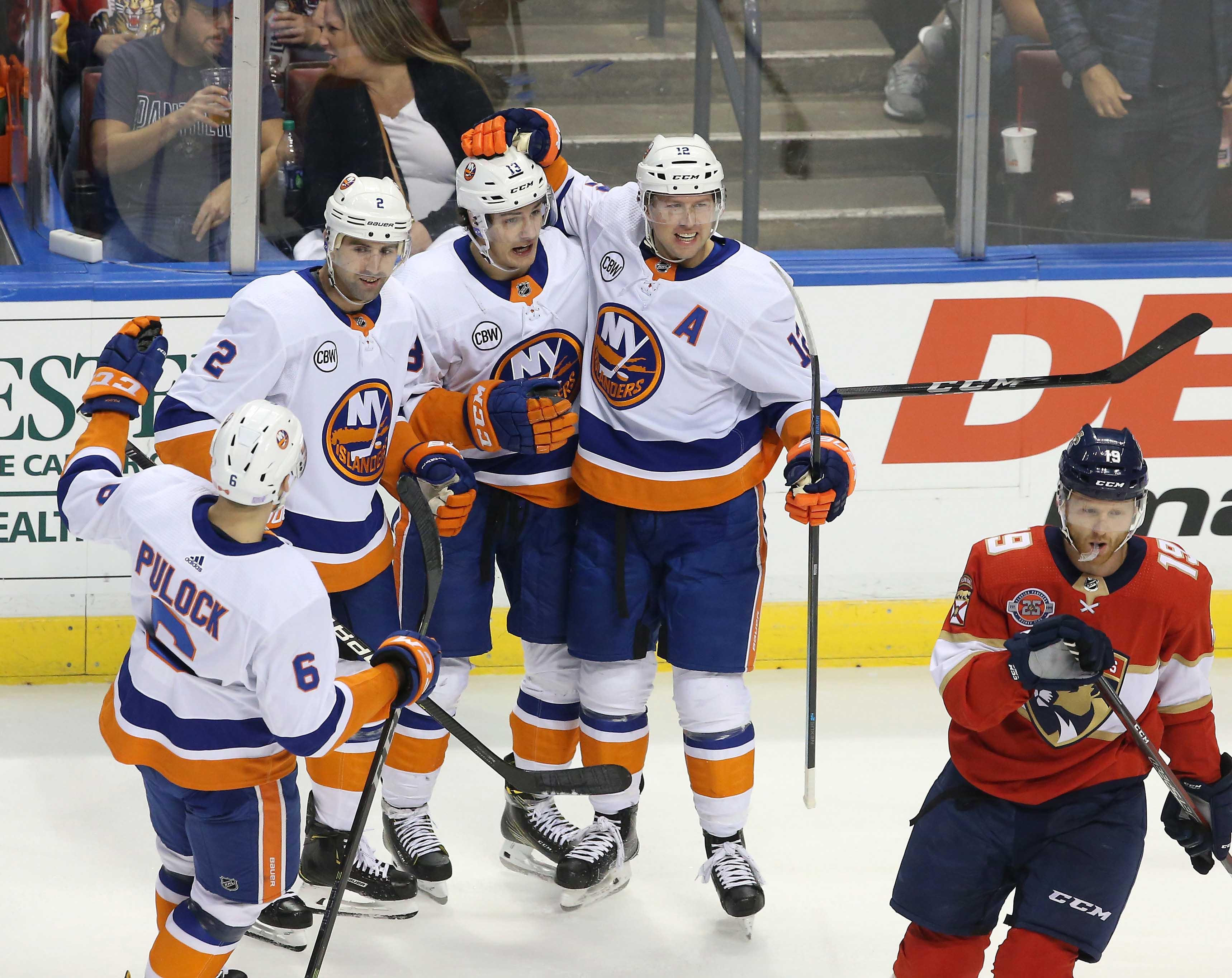 Nov 10, 2018; Sunrise, FL, USA; New York Islanders center Mathew Barzal (13) celebrates his goal against the Florida Panthers with left wing Josh Bailey (12) and defenseman Nick Leddy (2) in the first period at BB&T Center. Mandatory Credit: Robert Mayer-USA TODAY Sports