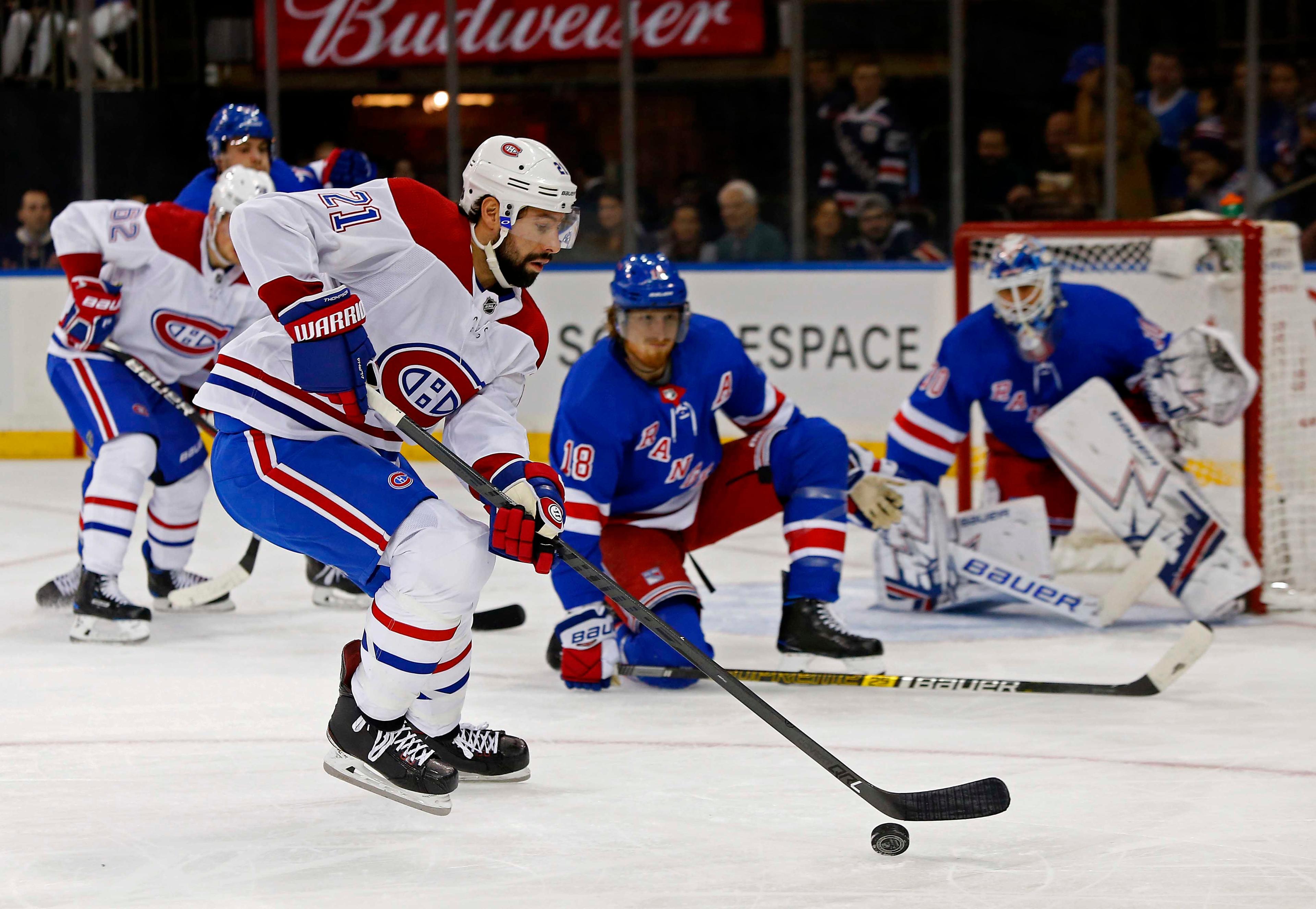 Mar 1, 2019; New York, NY, USA; Montreal Canadiens center Nate Thompson (21) controls the puck against New York Rangers defenseman Marc Staal (18) during the first period at Madison Square Garden. Mandatory Credit: Noah K. Murray-USA TODAY Sports