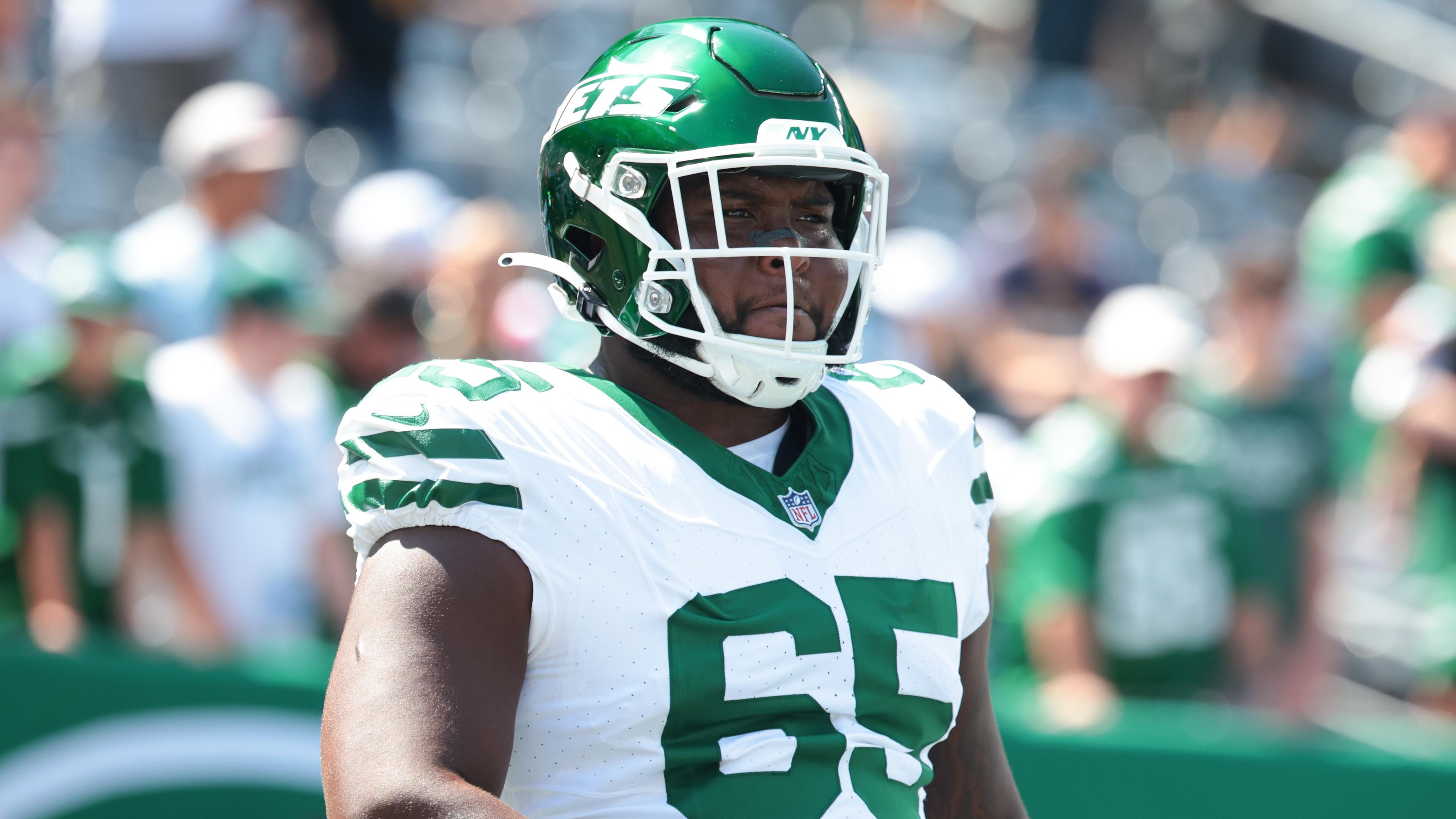 New York Jets guard Xavier Newman (65) looks on before the game against the Washington Commanders at MetLife Stadium