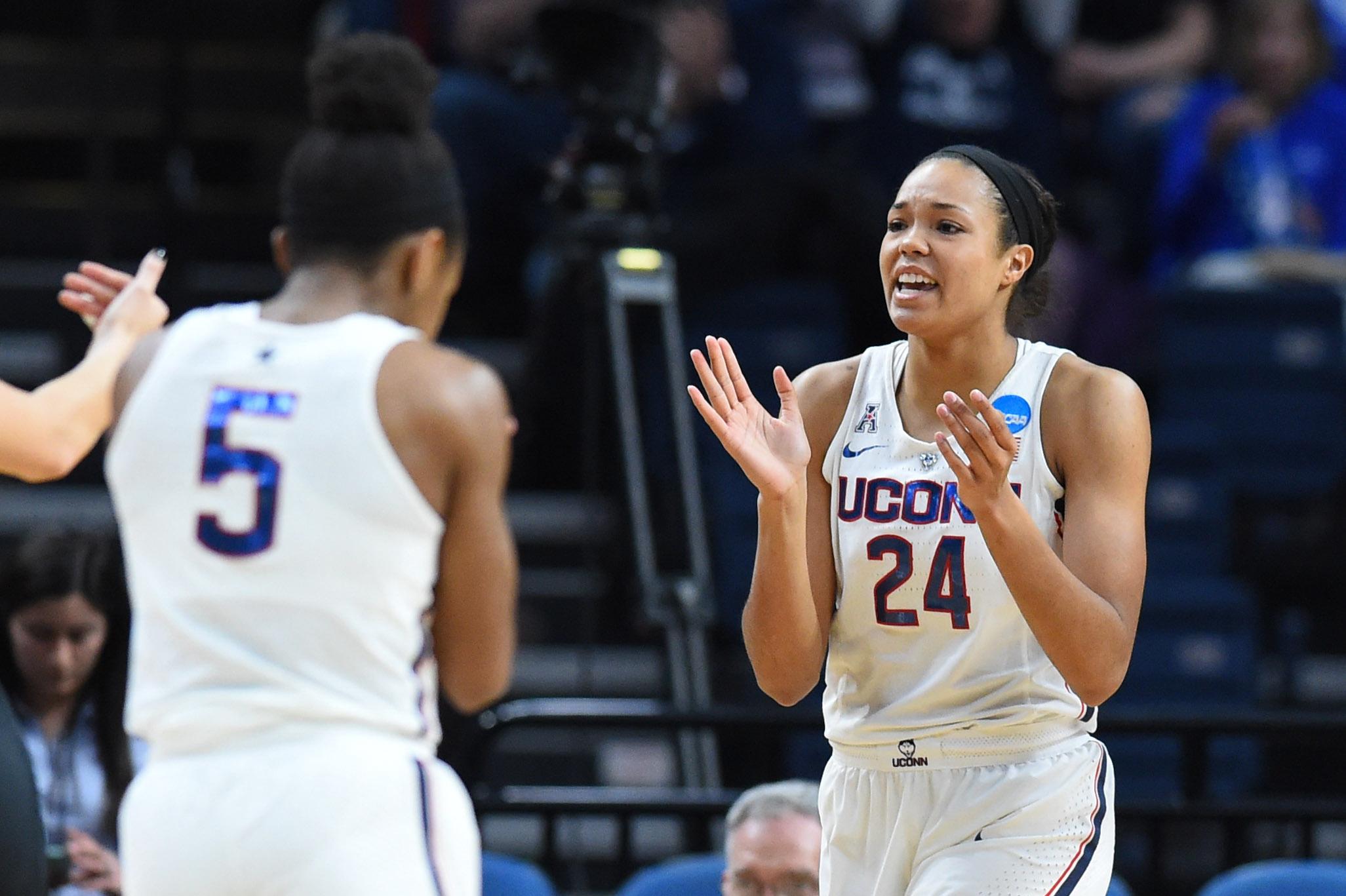 Connecticut Huskies forward Napheesa Collier reacts to a play with teammate Crystal Dangerfield against the Duke Blue Devils during the first half in the semifinals of the Albany regional of the women's basketball 2018 NCAA tournament at Times Union Center.