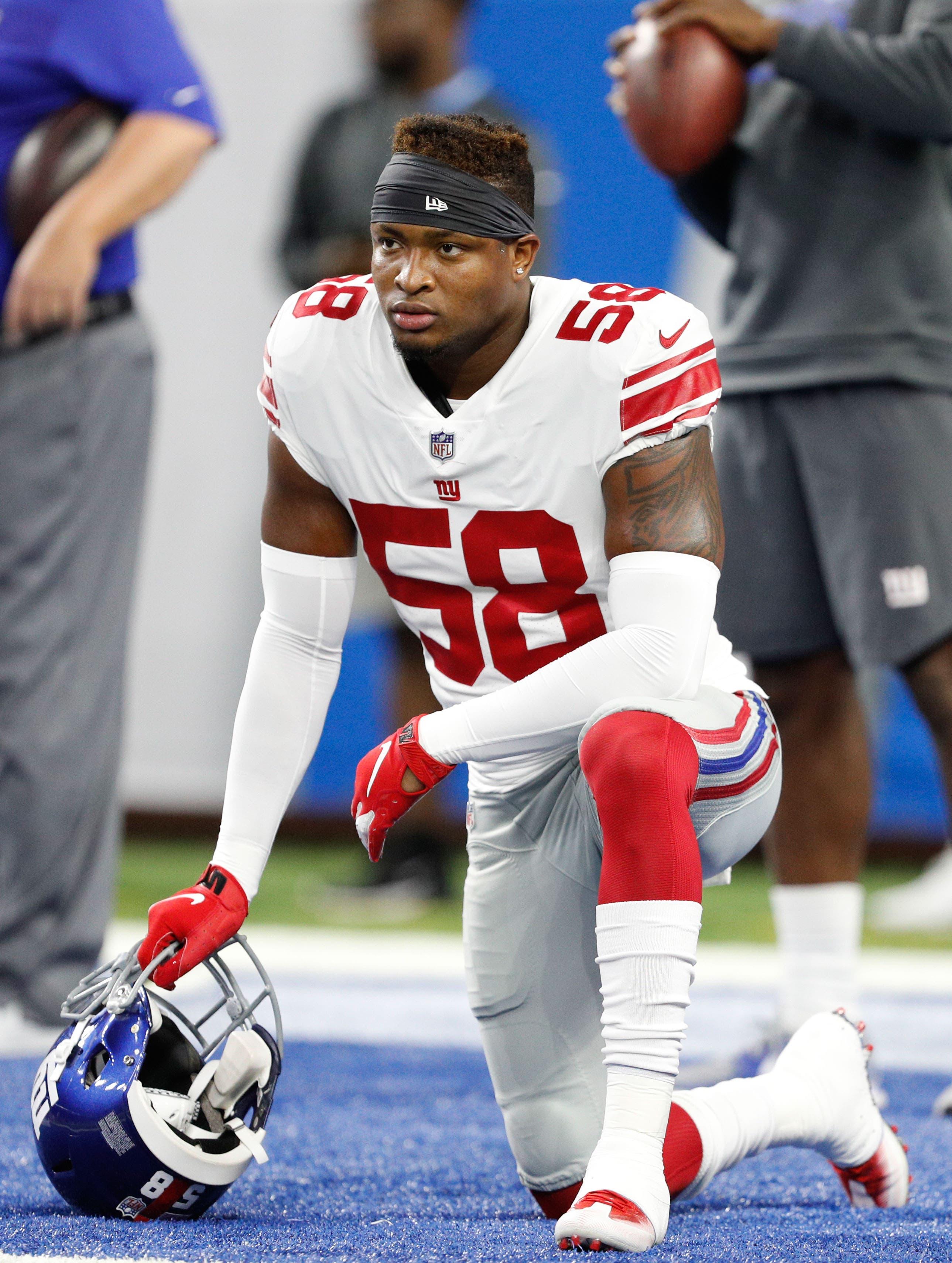 Aug 17, 2018; Detroit, MI, USA; New York Giants linebacker Tae Davis (58) takes a knee before the game against the Detroit Lions at Ford Field. Mandatory Credit: Raj Mehta-USA TODAY Sports / Raj Mehta