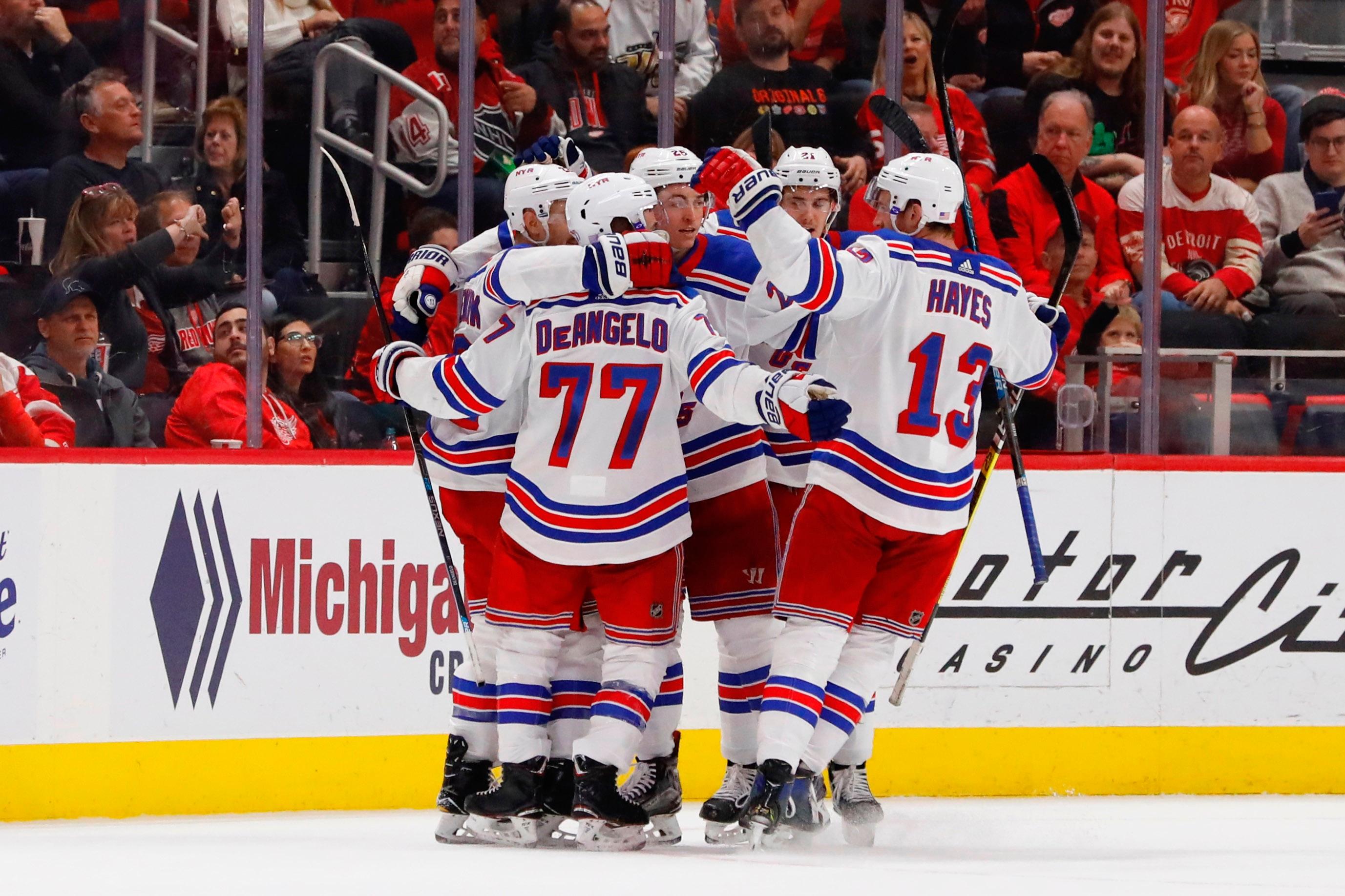 Nov 9, 2018; Detroit, MI, USA; New York Rangers defenseman Kevin Shattenkirk (22) is congratulated by teammates after scoring in the second period against the Detroit Red Wings at Little Caesars Arena. Mandatory Credit: Rick Osentoski-USA TODAY Sports