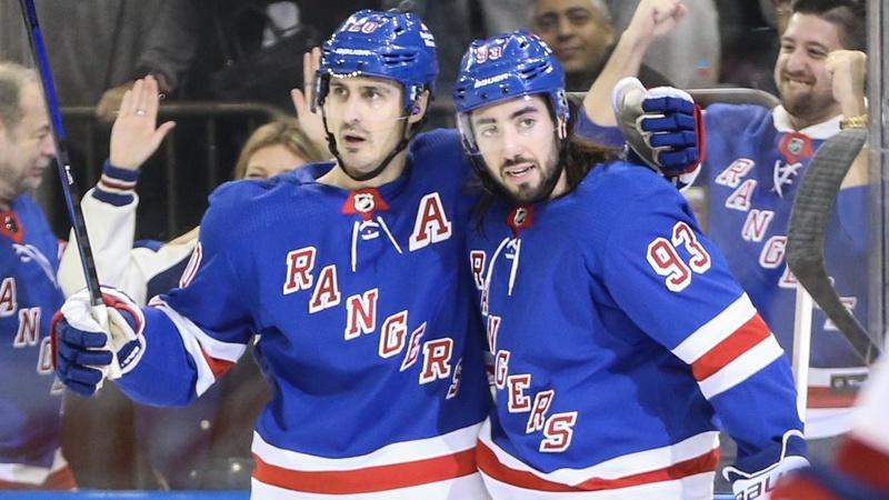 New York Rangers left wing Chris Kreider (20) celebrates with center Mika Zibanejad (93) after scoring a goal in the second period against the Montreal Canadiens at Madison Square Garden. / Wendell Cruz-USA TODAY Sports