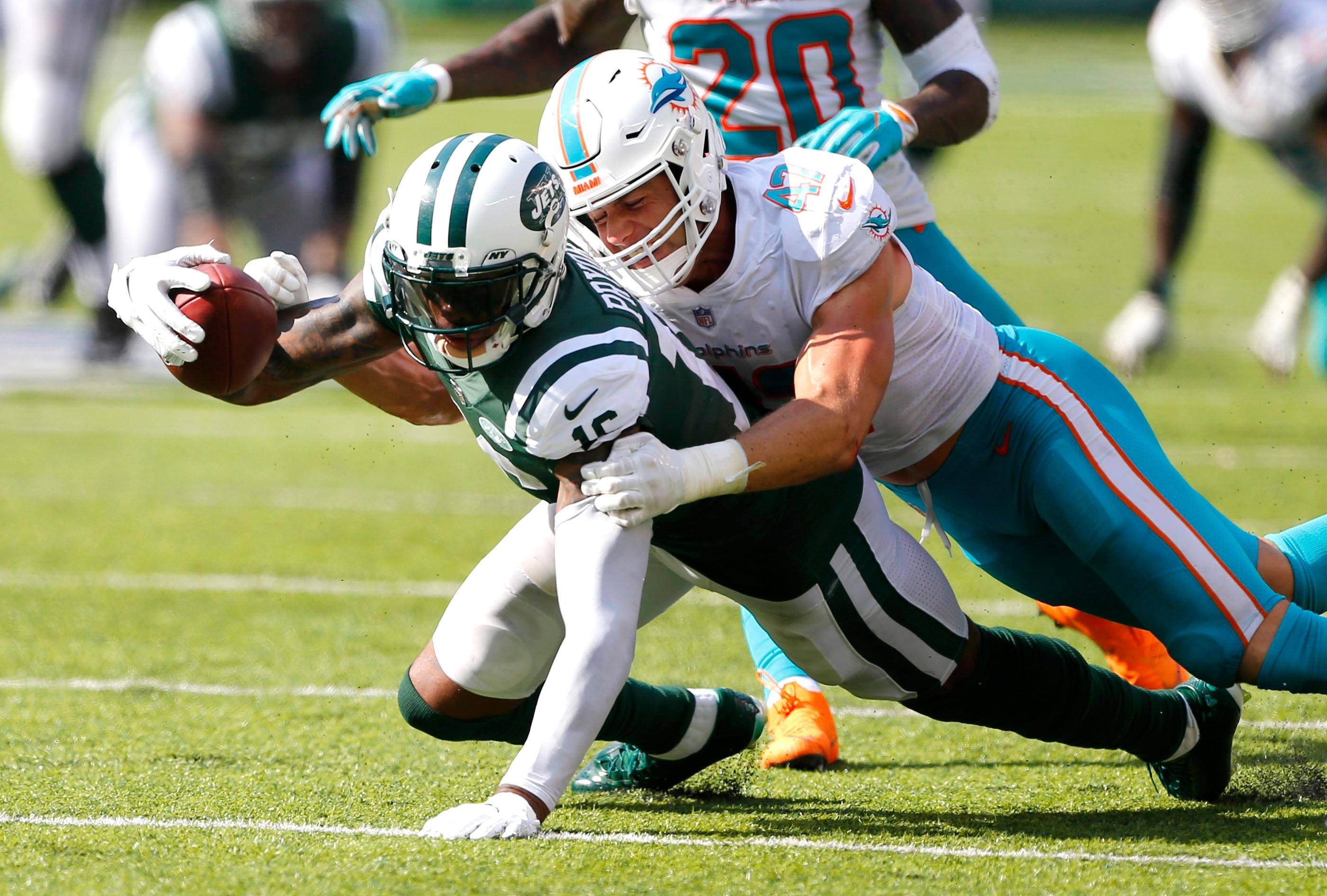 New York Jets wide receiver Terrelle Pryor is tackled after a catch by Miami Dolphins linebacker Kiko Alonso during the second half at MetLife Stadium.