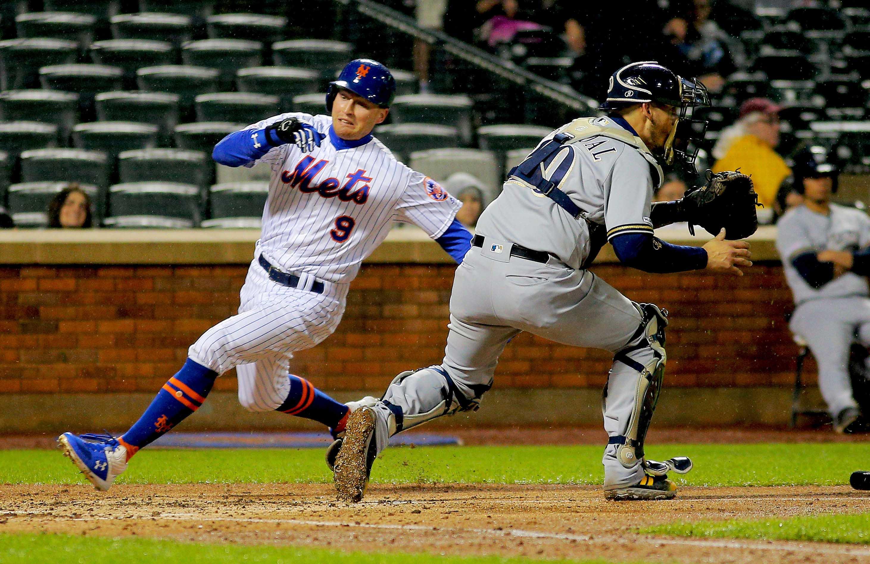 Apr 26, 2019; New York City, NY, USA; New York Mets center fielder Brandon Nimmo (9) scores on a an RBI single by third baseman Todd Frazier (not pictured) against the Milwaukee Brewers during the fourth inning at Citi Field. Mandatory Credit: Andy Marlin-USA TODAY Sports / Andy Marlin