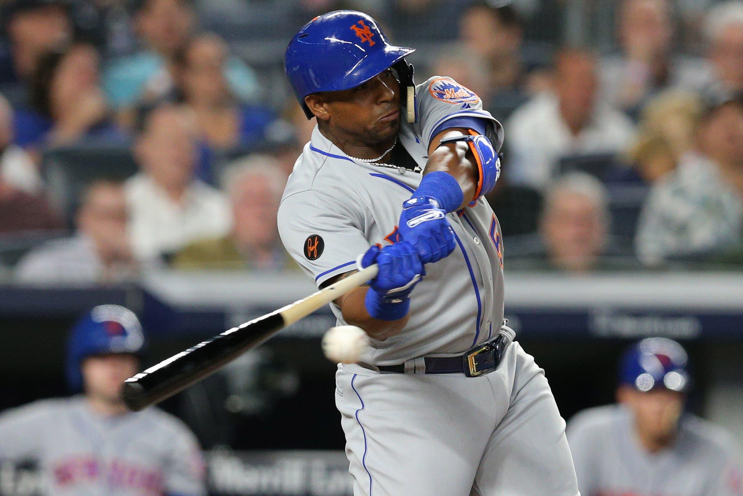 Jul 20, 2018; Bronx, NY, USA; New York Mets designated hitter Yoenis Cespedes (52) hits a single against the New York Yankees during the sixth inning at Yankee Stadium. Mandatory Credit: Brad Penner-USA TODAY Sports / Brad Penner