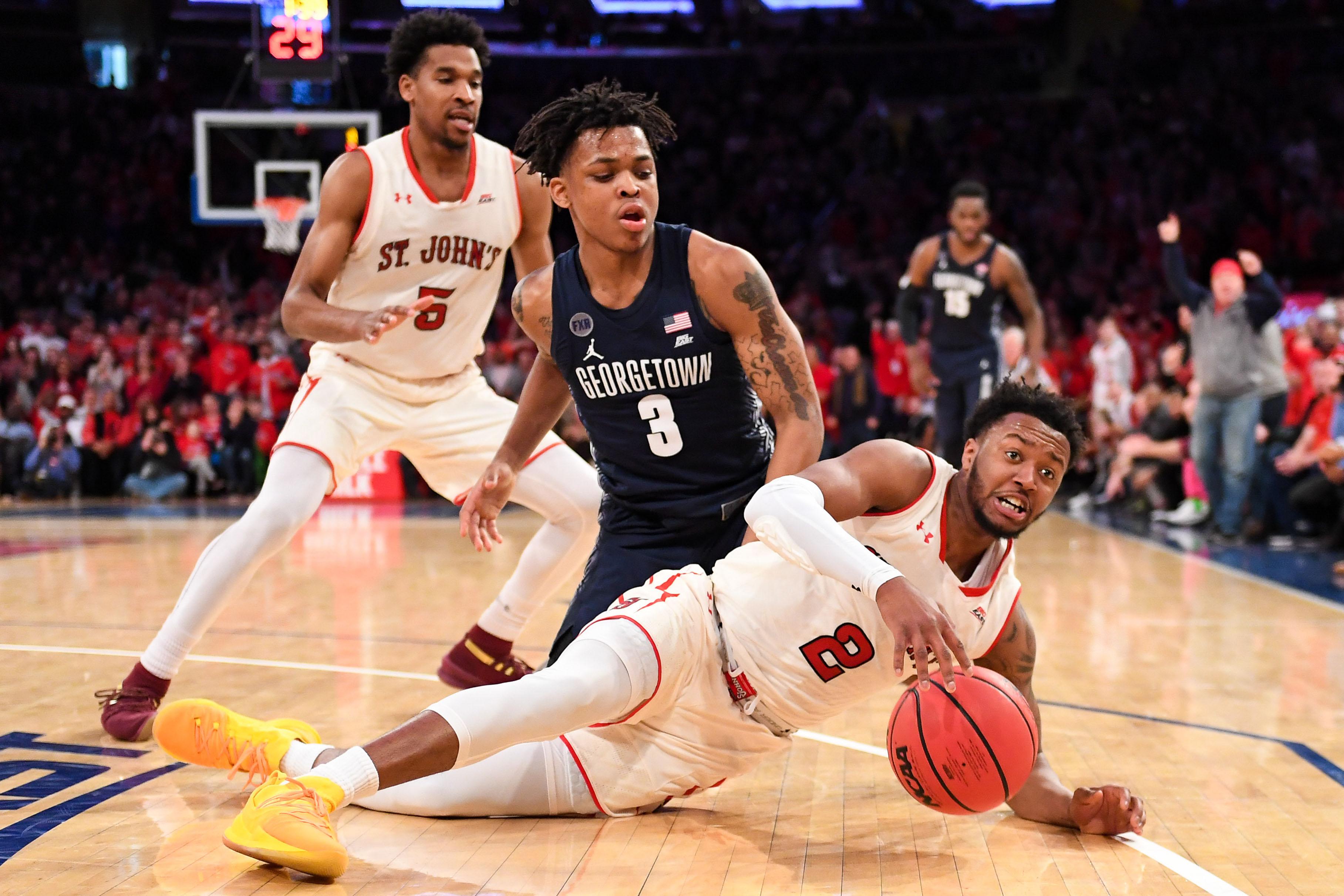 Jan 27, 2019; New York, NY, USA; St. John's Red Storm guard Shamorie Ponds (2) and Georgetown Hoyas guard James Akinjo (3) battle for a loose ball during the second half at Madison Square Garden. Mandatory Credit: Dennis Schneidler-USA TODAY Sports