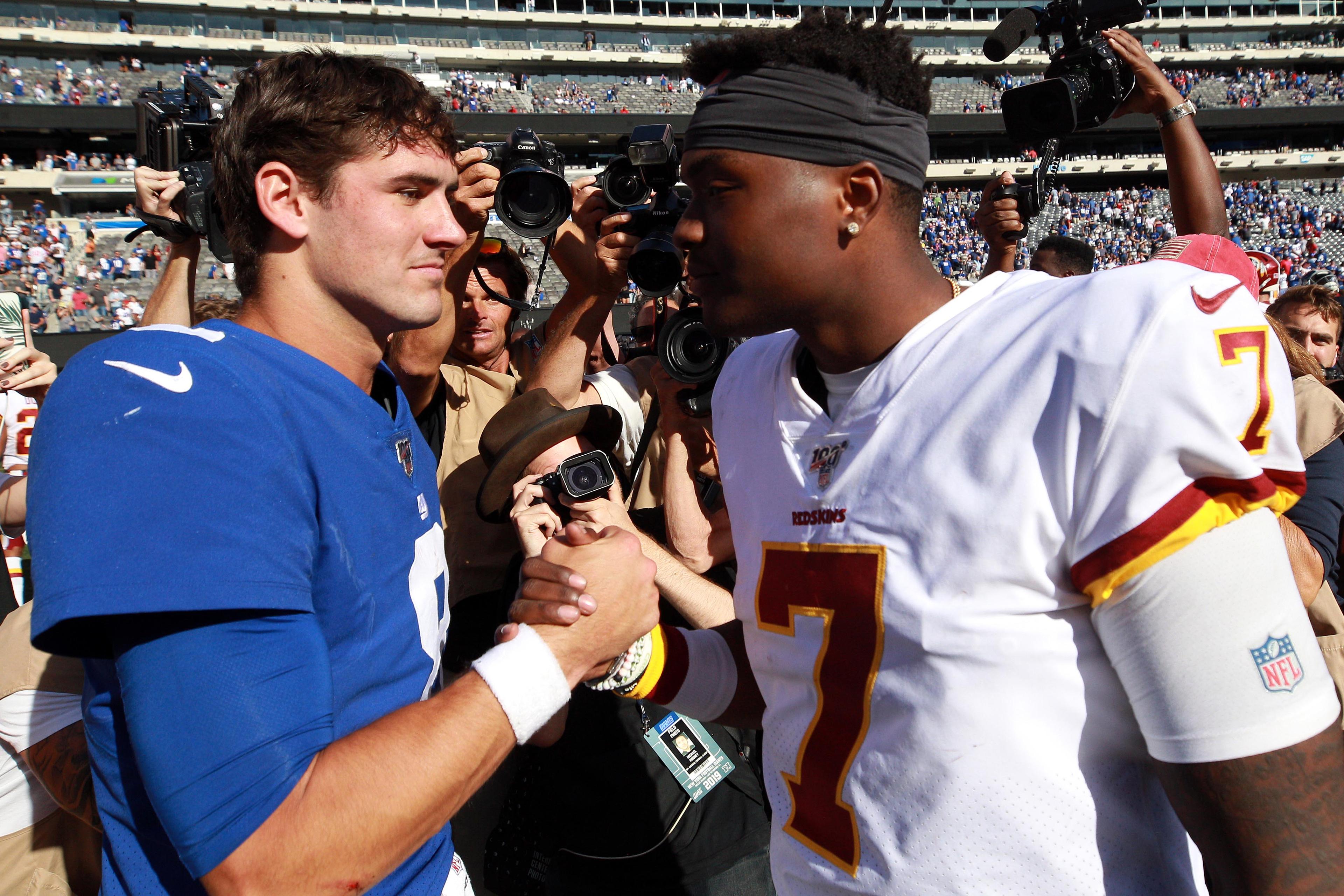 Sep 29, 2019; East Rutherford, NJ, USA; New York Giants quarterback Daniel Jones (8) shakes hands with Washington Redskins quarterback Dwayne Haskins (7) after a game at MetLife Stadium. Mandatory Credit: Brad Penner-USA TODAY Sports