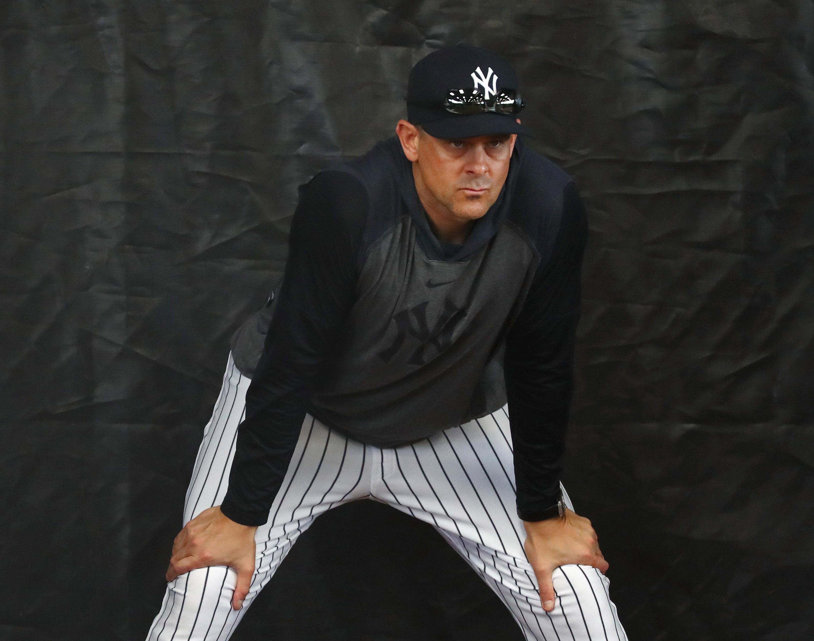 Feb 12, 2020; Tampa, Florida, USA; New York Yankees manager Aaron Boone (17) looks on as pitchers and catchers report for spring training at George M. Steinbrenner Field. Mandatory Credit: Kim Klement-USA TODAY Sports