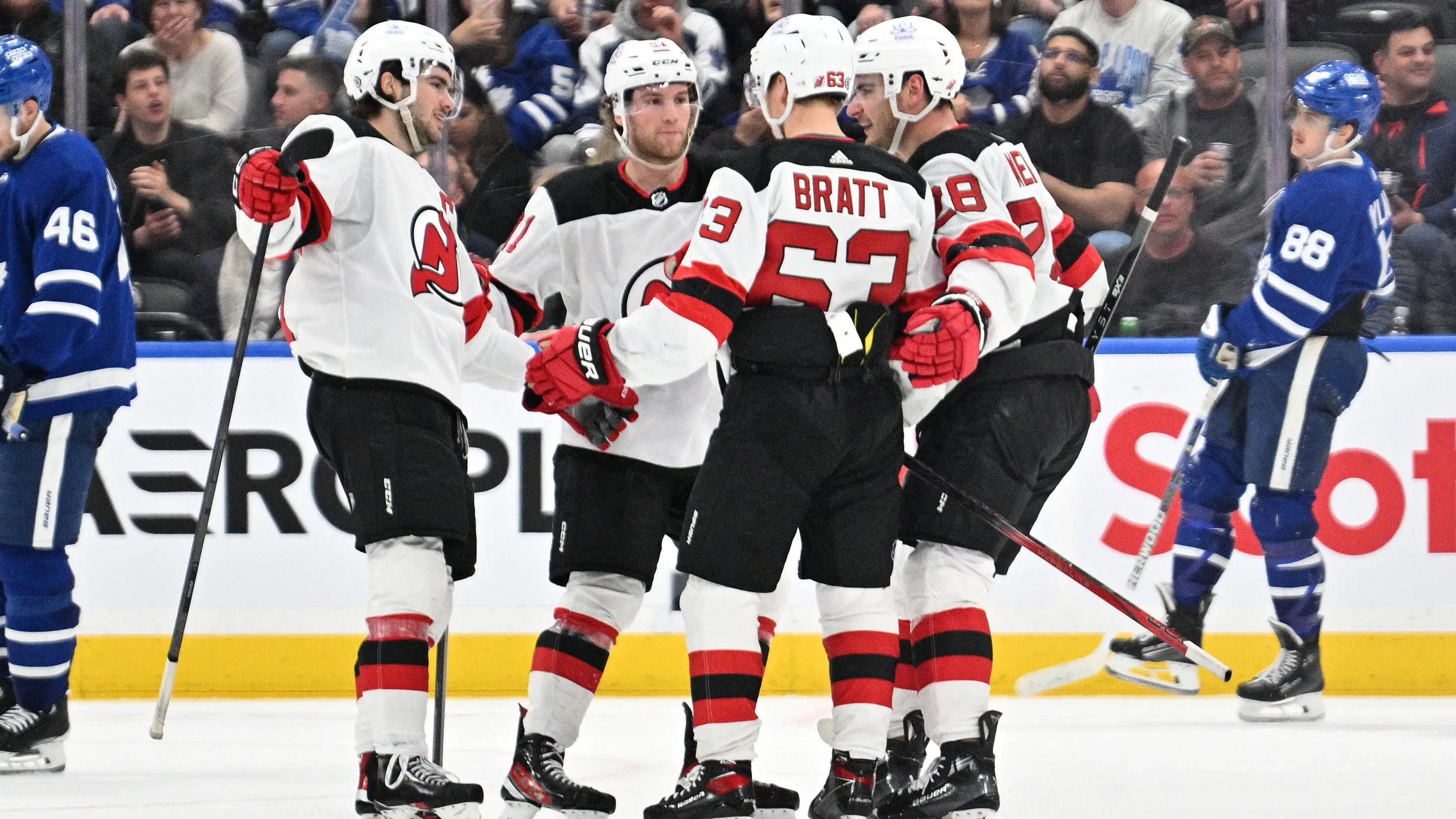 New Jersey Devils forward Jesper Bratt (63) celebrates with team mates after scoring a goal against the Toronto Maple Leafs in the third period at Scotiabank Arena / Dan Hamilton - USA TODAY Sports